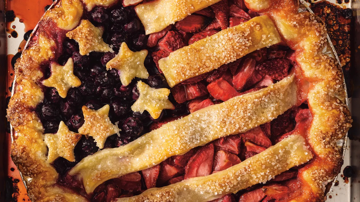 Double butter crust, strawberries, and blueberries comprise this patriotic stars and stripes pie.