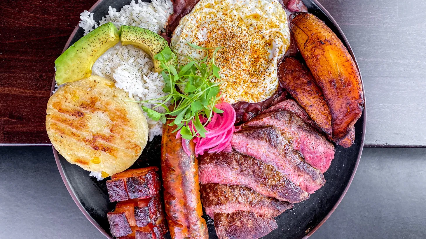 Bandeja paisa and yucca chorreadas encourage diners to share