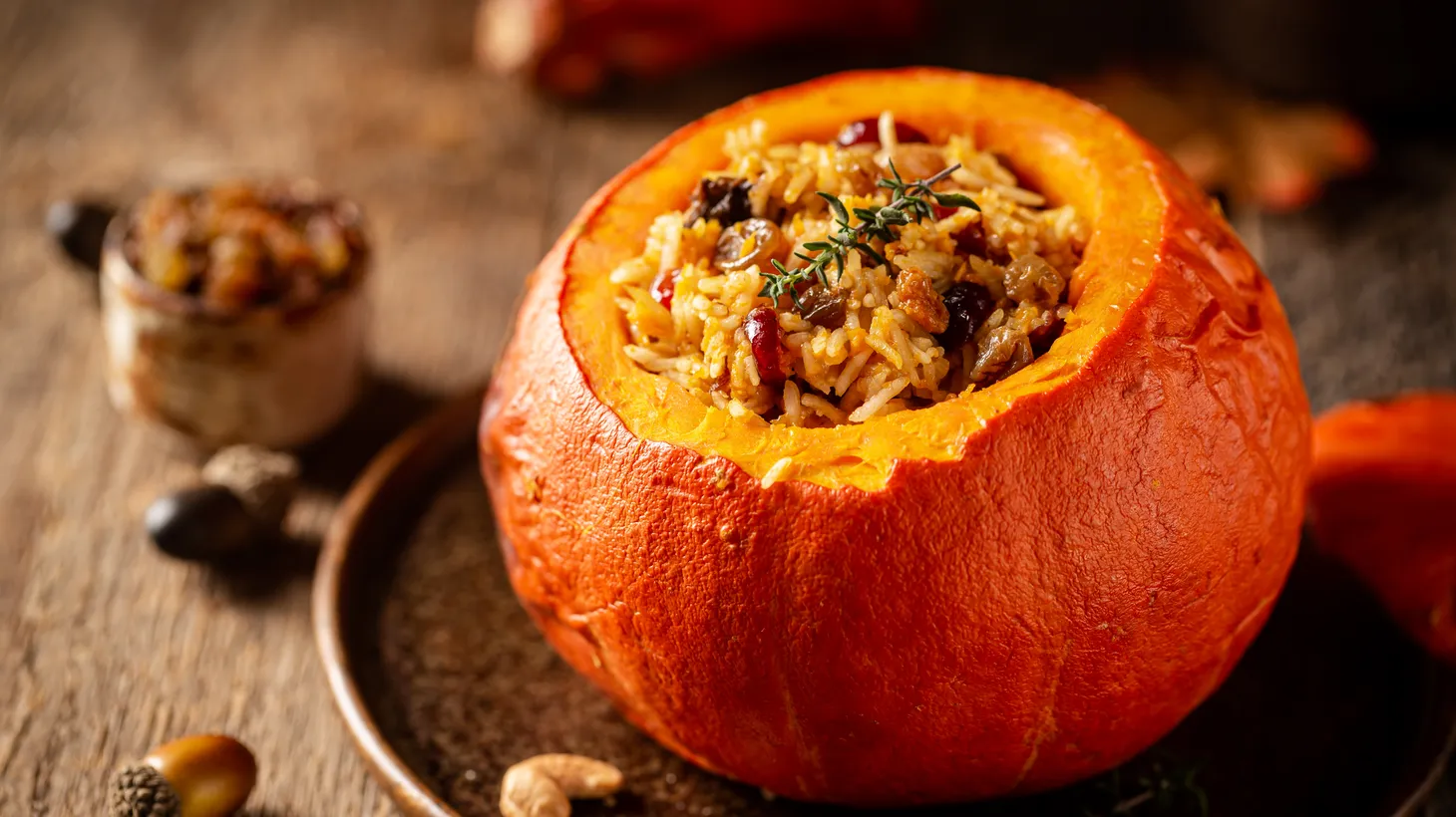 A pumpkin stuffed with rice, vegetables and herbs is a tasty and showstopping main dish for a Thanksgiving meal.