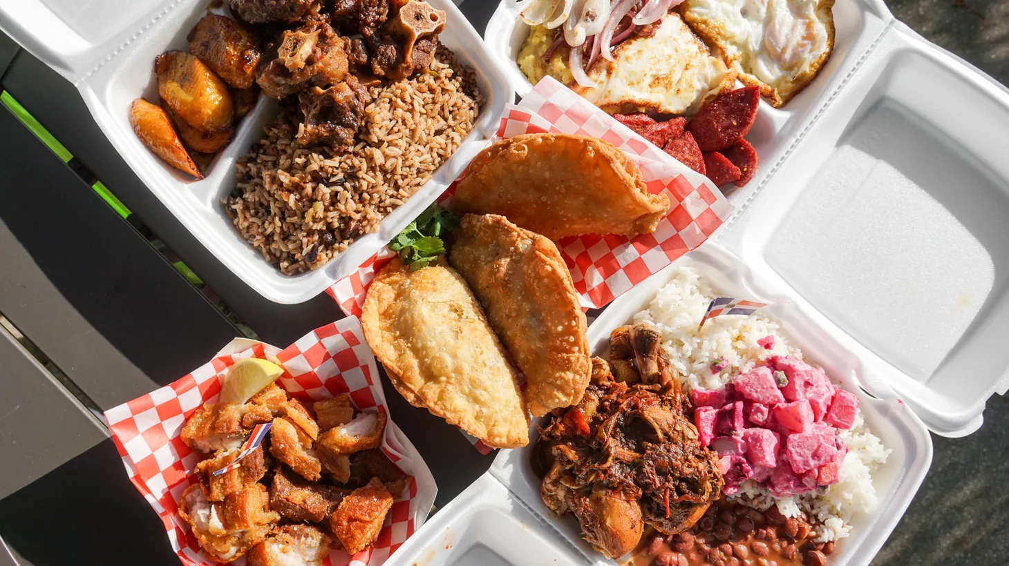 Karribean Cuisine serves oxtails, pastelitos, and tres golpes, a traditional Dominican breakfast of fried cheese, eggs, salami, and mangú (mashed plantains).