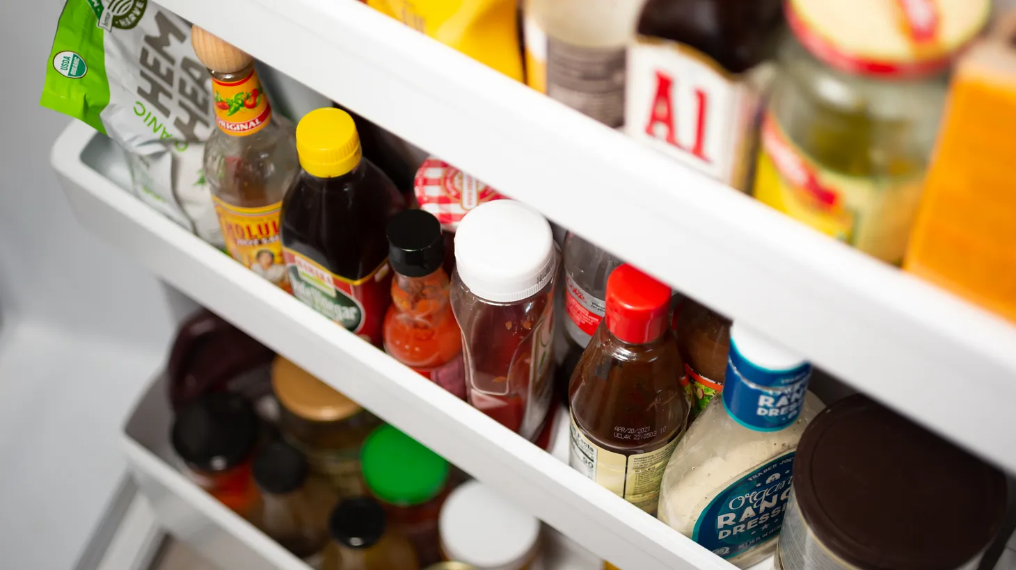 Condiments on the refrigerator door, like mustard and jams, can be used in unexpected ways to make the perfect salad dressing.