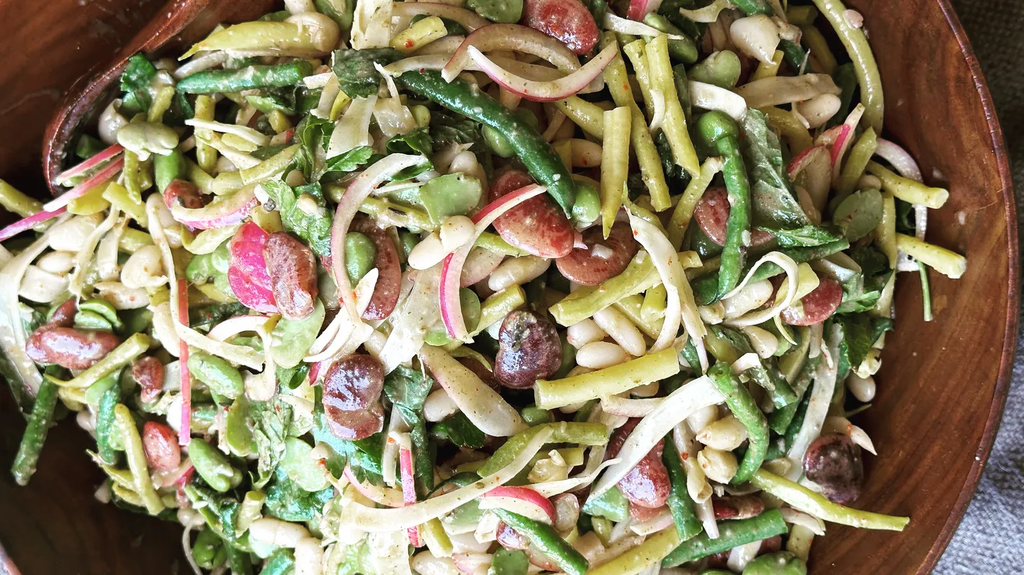 Fresh blue lake green beans and yellow wax beans are blanched and combined with cooked dried varieties for a seasonal bean salad.