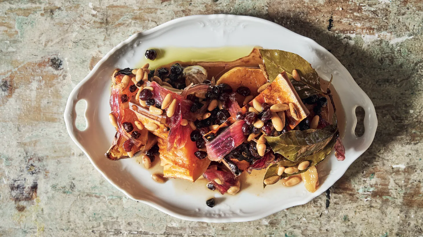A roasted squash dish adorned with currants and pine nuts celebrates the season and rings in fall. Chef Jody Williams says it can be served warm or at room temperature and is even better the next day.