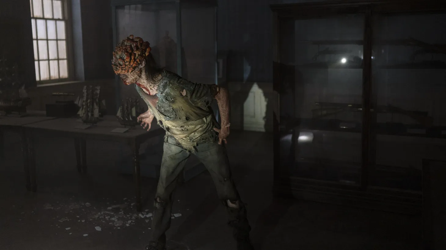 More fungus than human, clickers bloom mushrooms from their skull in "The Last of Us."