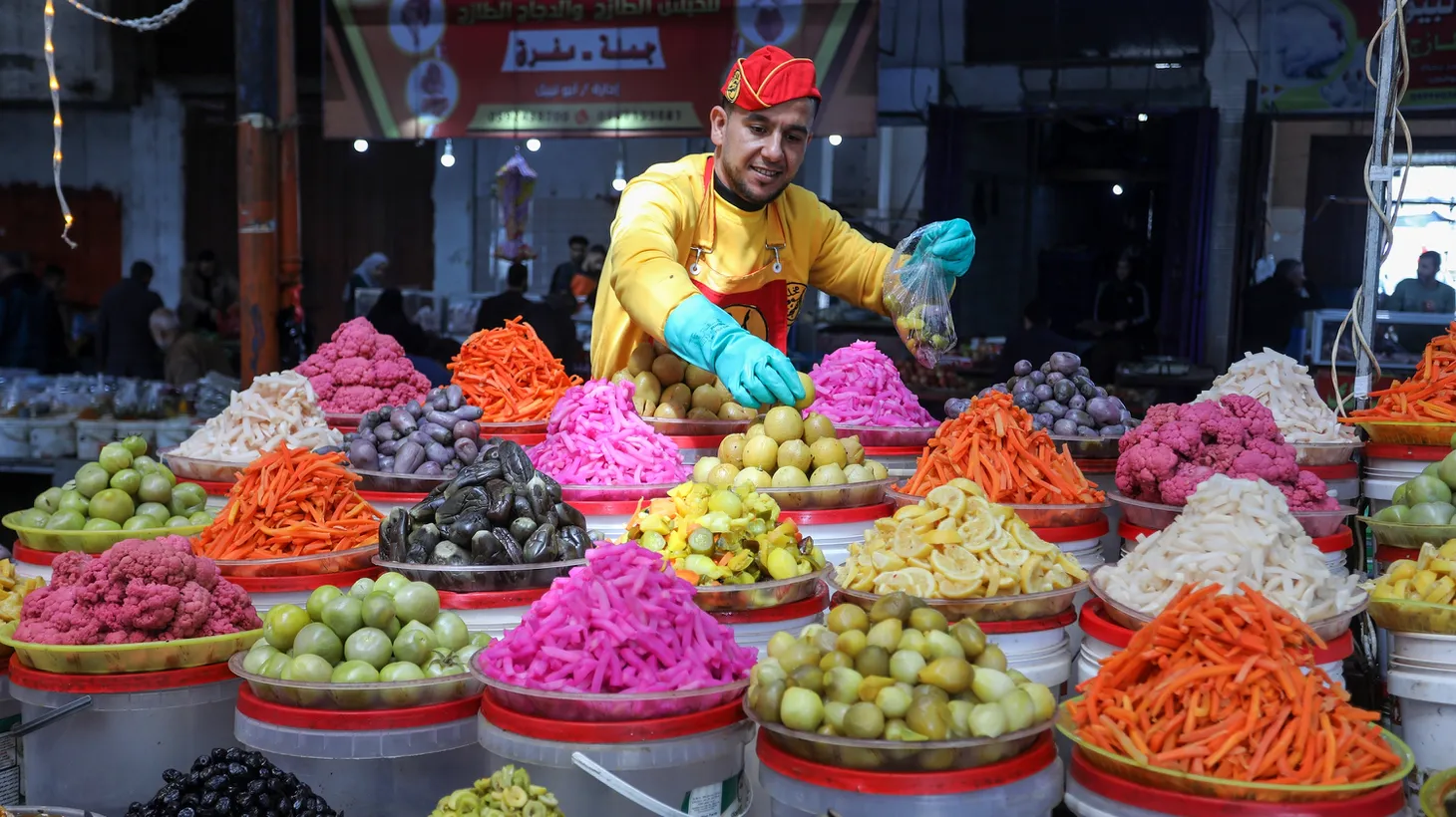 At a market in the city of Rafah, in the southern Gaza Strip, people shop for food ahead of Ramadan.