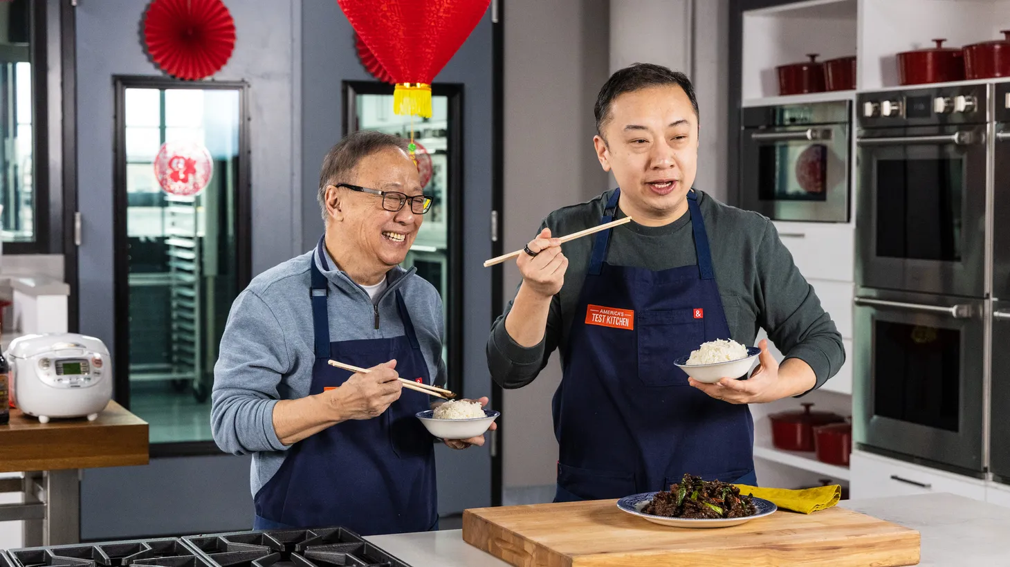 Jeffrey Pang (left) and his son Kevin making their family's Cantonese recipes in the YouTube series "Hunger Pangs."