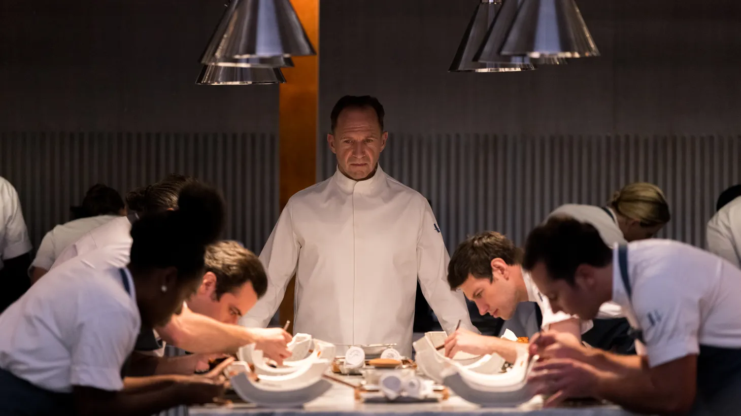 "We wrote this stupid thing so that we can get free food and I don't think it's going to happen," jest screenwriters Seth Reiss and Will Tracy. Their film "The Menu," stars Ralph Fiennes (pictured) as a chef who exacts revenge on his well-heeled patrons.