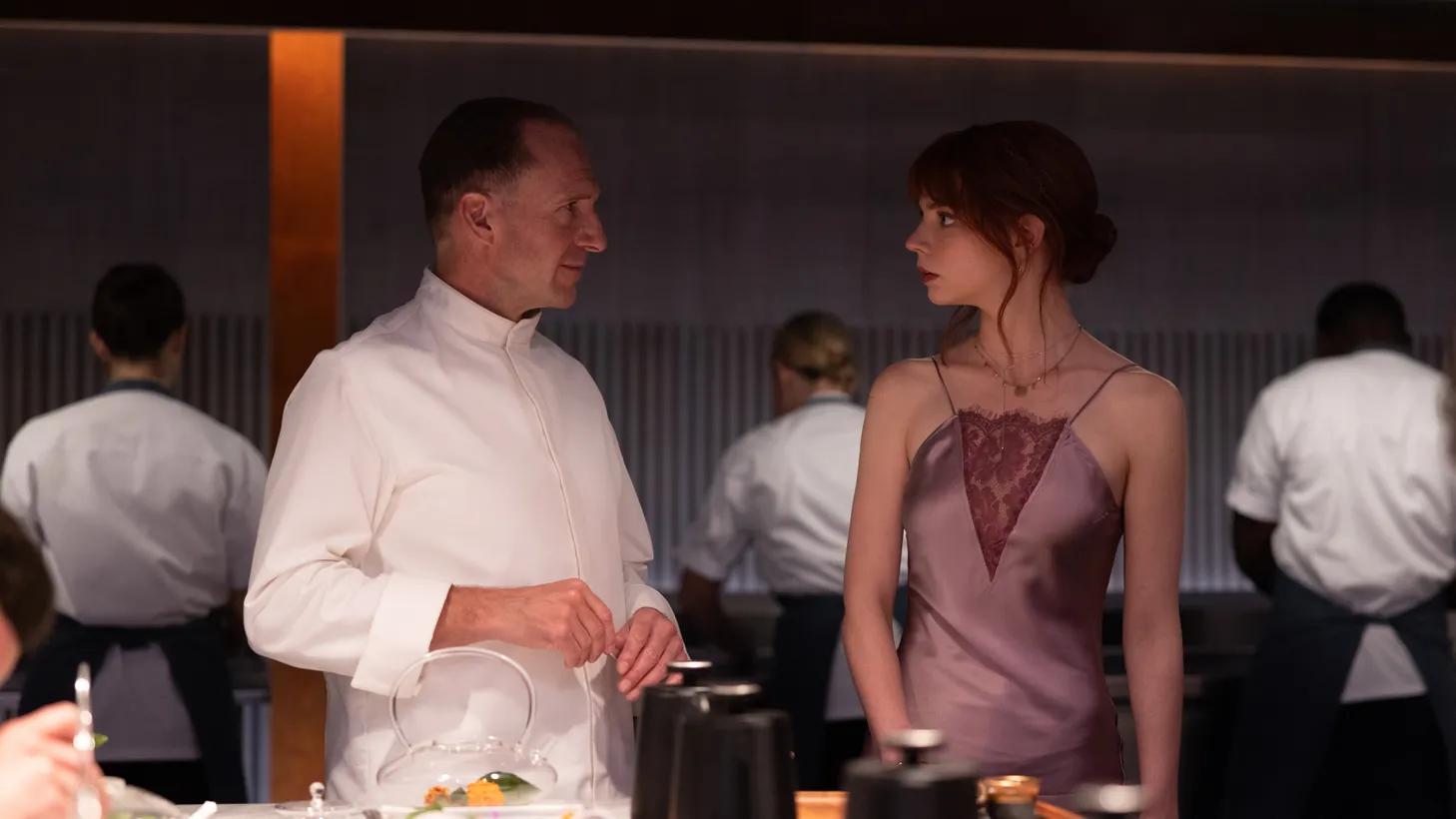 Ralph Fiennes (left) plays Julian Slowik, a chef looking to exact revenge on both his critics and acolytes in "The Menu." The actor and Anya Taylor-Joy were both nominated for Golden Globes for their roles.