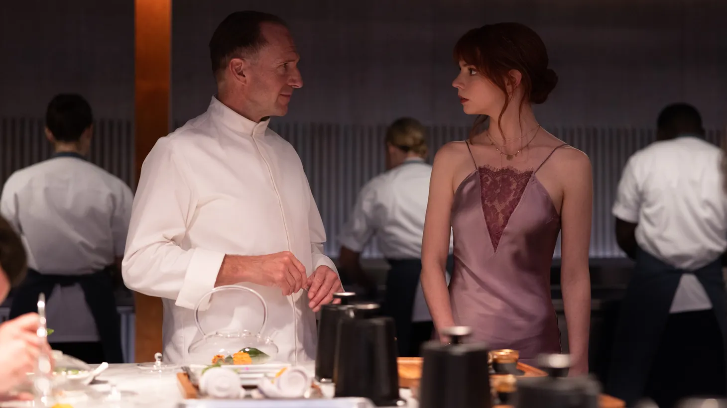 Ralph Fiennes (left) plays Julian Slowik, a chef looking to exact revenge on both his critics and acolytes in "The Menu." He and Anya Taylor-Joy were both nominated for Golden Globes for their roles.