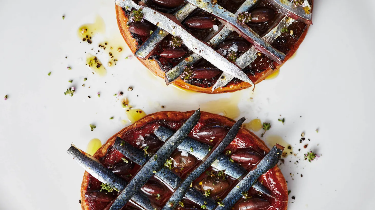 Josh Niland uses his experience working in a French restaurant in Sydney to create a pissaladiere in which he substitutes latticed sardines for anchovies to tame the salf-forward dish.
