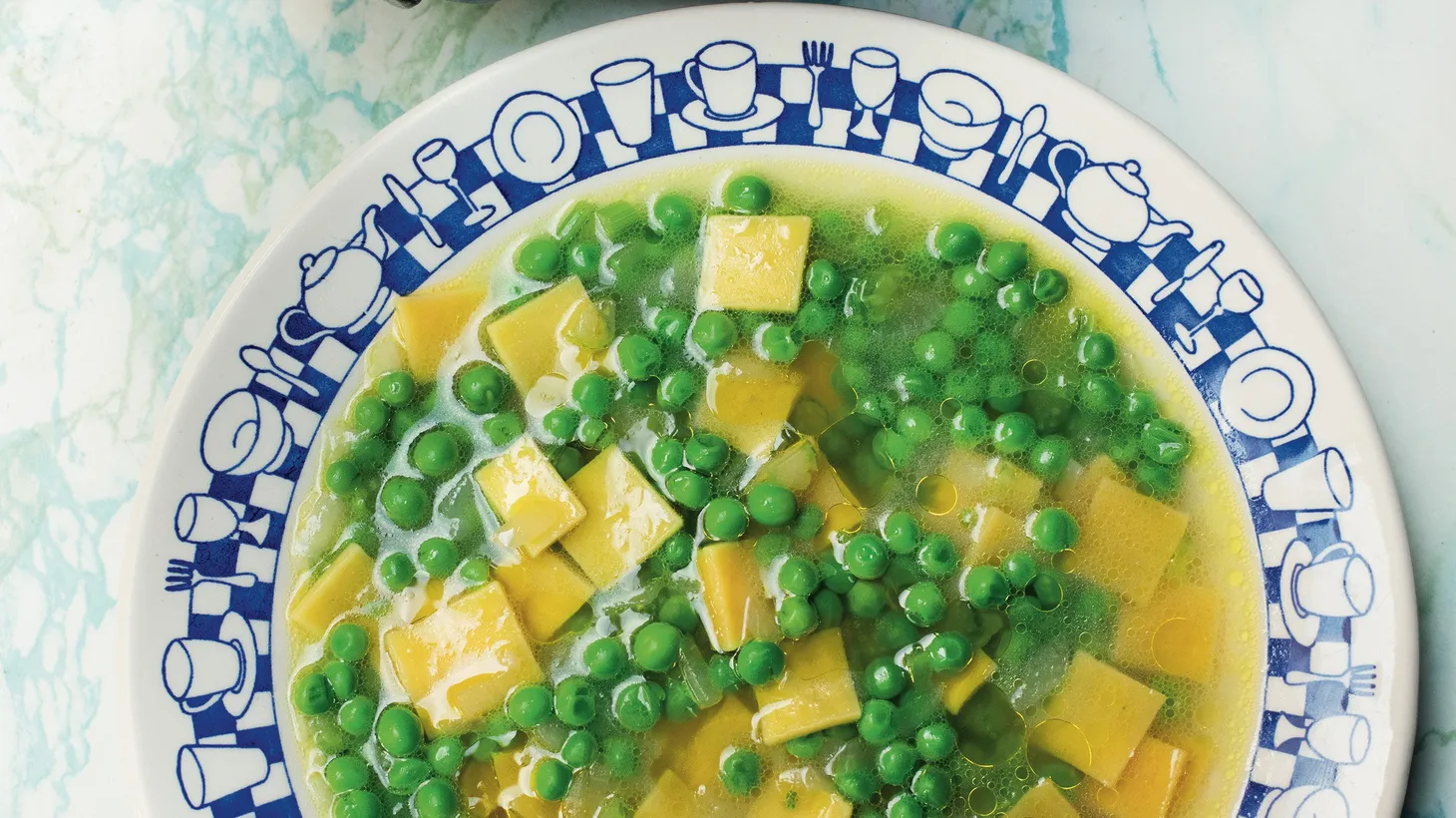 Squares of pasta with peas known as quadrucci served with a cheesy broth hails from Rome.