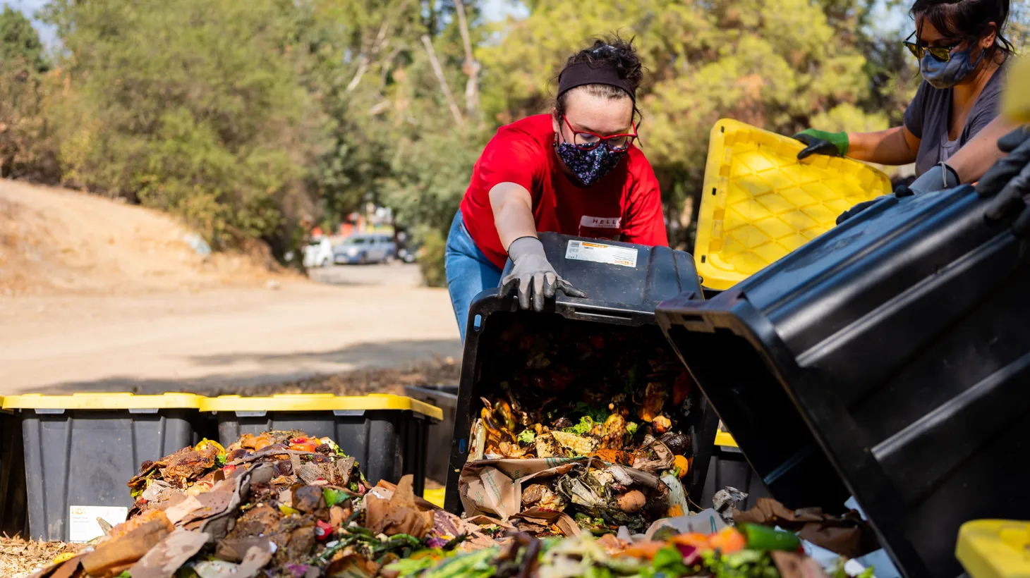 Volunteers work at LA Compost, just one hub for food waste collection under the new mandate in Los Angeles.