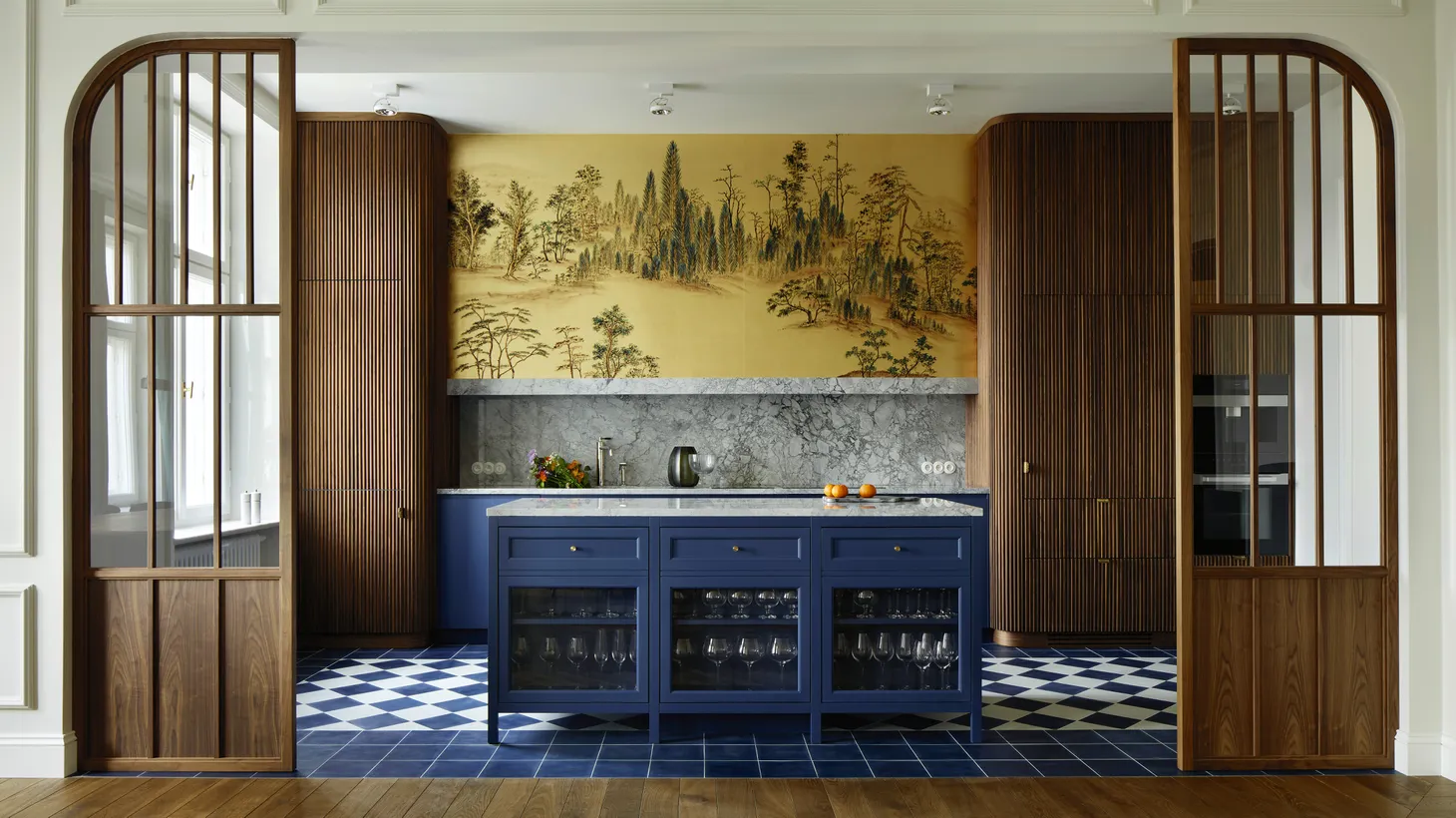 The art in this Warsaw kitchen is an oversized hand-painted wallpaper panel.