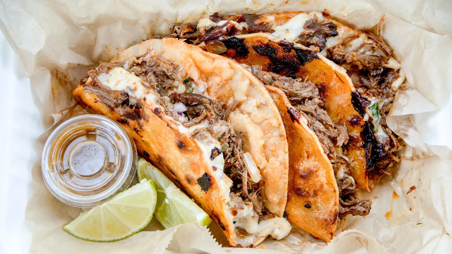 With its reddish-orange stained tortilla filled with birria and crisped on the griddle, the quesabirria from La Olla is one of Bill Addison’s favorite dishes at the newly opened Blossom Market Hall.
