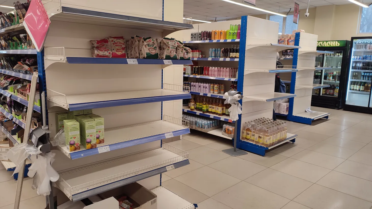 Shelves of staple products are empty at an ATB Shop in Mariupol, Ukraine.