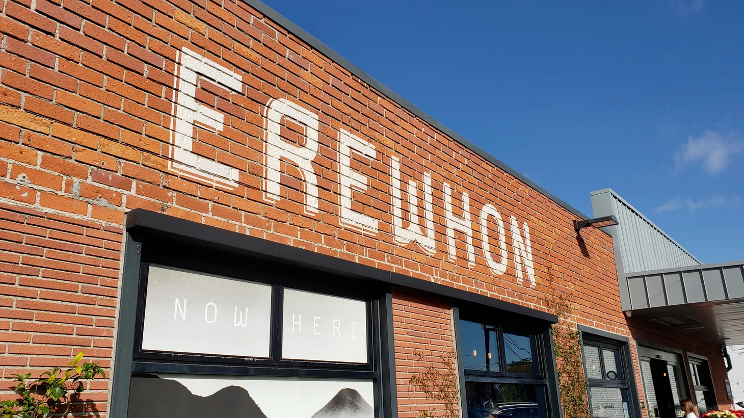 A store front sign for the upscale organic grocery store chain known as Erewhon, in Venice Beach, CA.