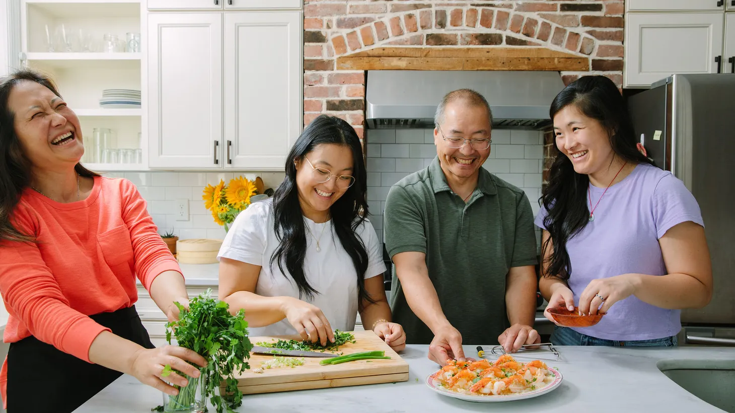 (From left to right) Judy, Kaitlin, Bill, and Sarah Leung created a blog, The Woks of Life, nearly a decade ago which has become the top online resource for Chinese cooking in English.