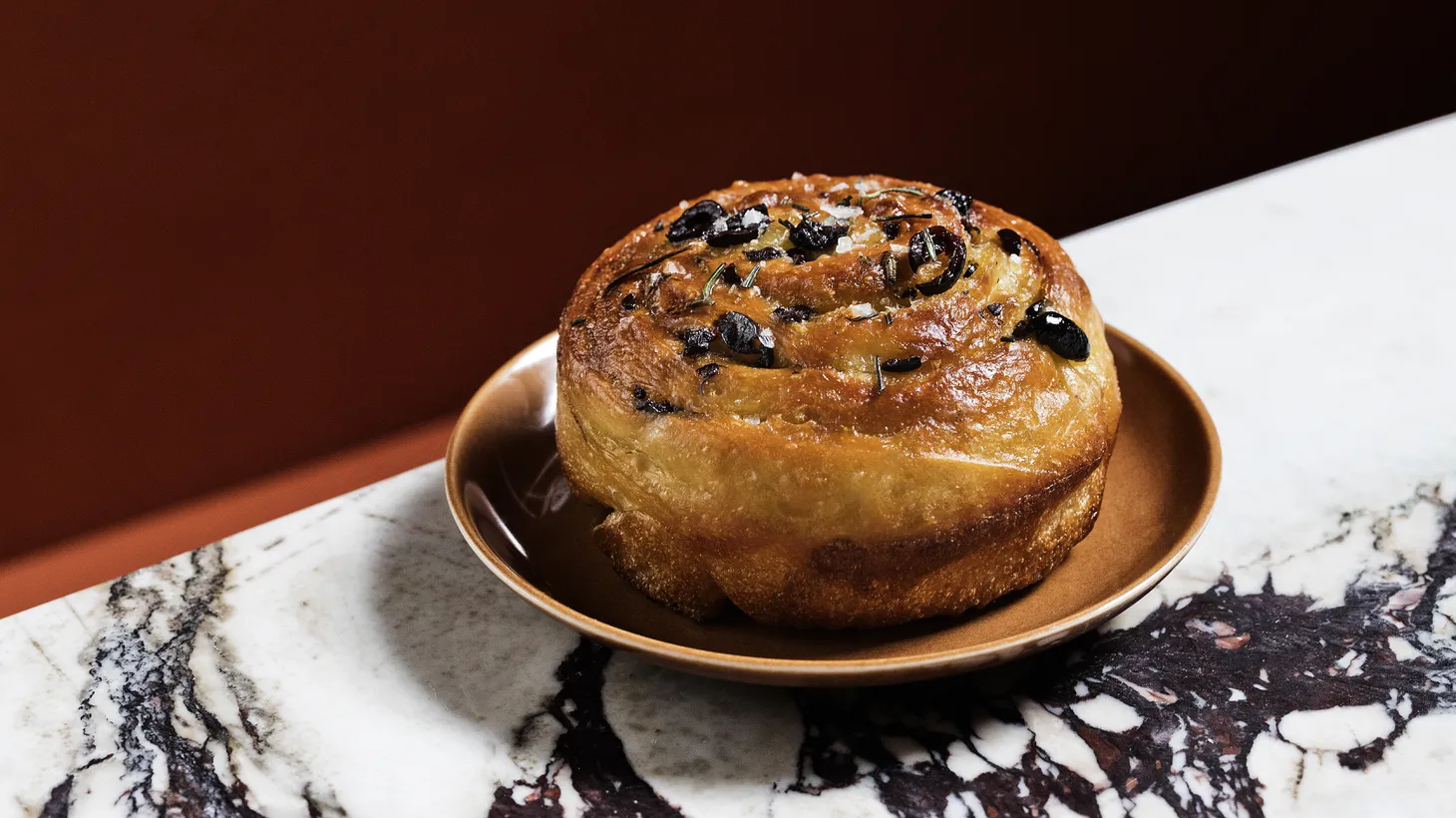 A must-order from Bacetti is the focaccia ebraica, made with black olives, currants, rosemary, and sea salt.