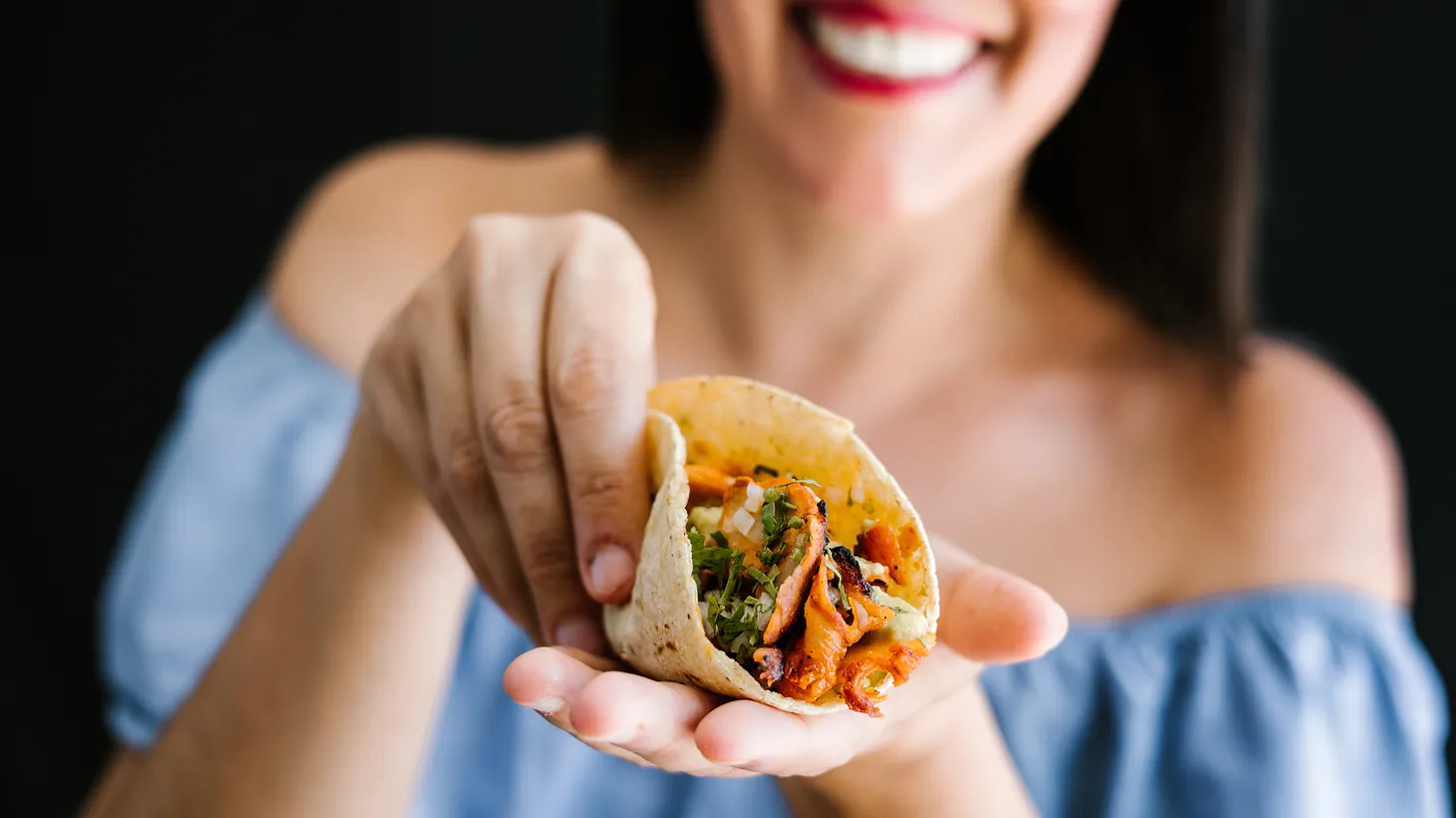 This stock image lady would love for you to eat her tortilla and whatever is in it. But we have tastier options for you, thanks to the 2023 Tortilla Tournament.