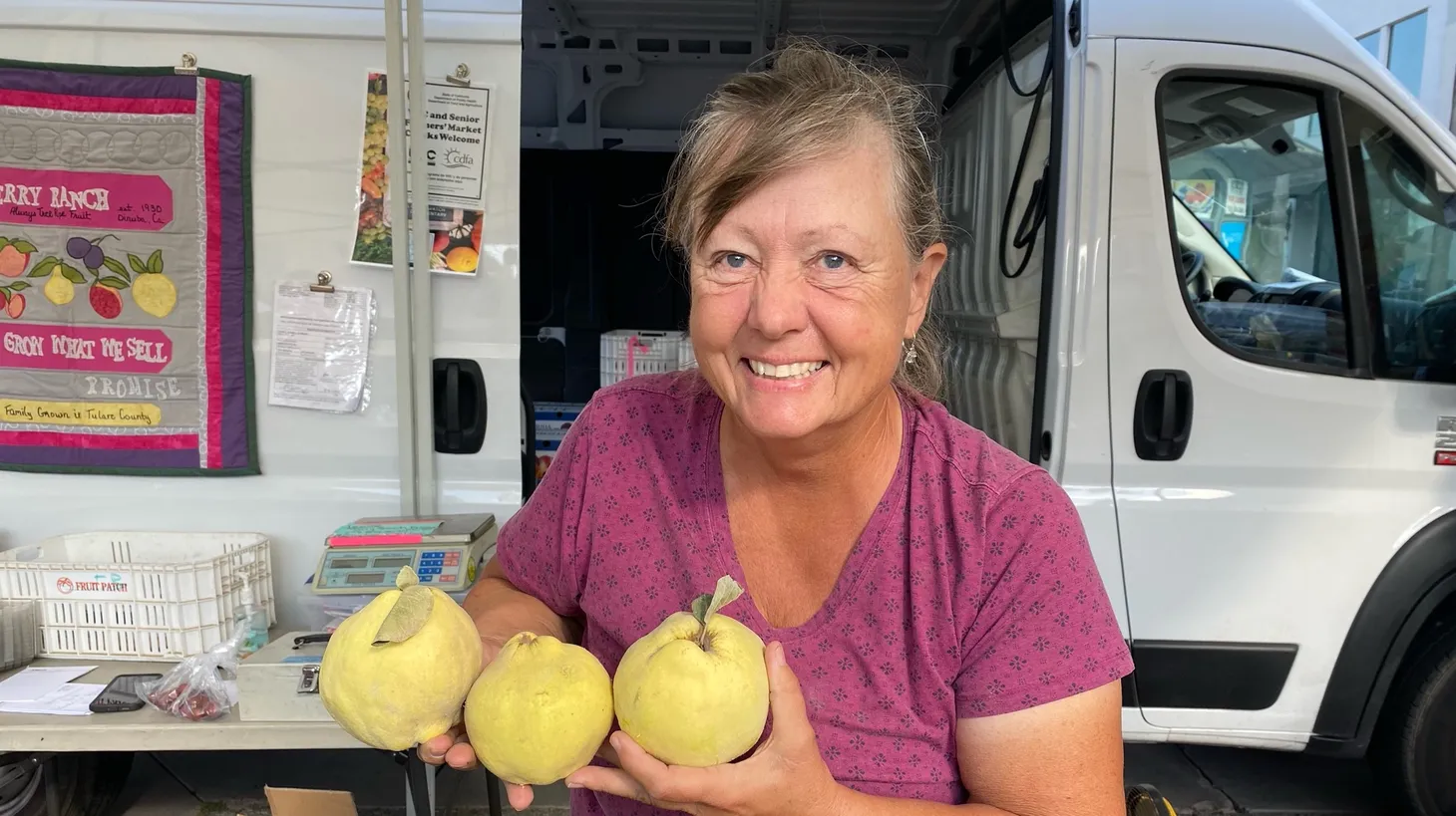 Becky Terry shows off the quince she brings to market.