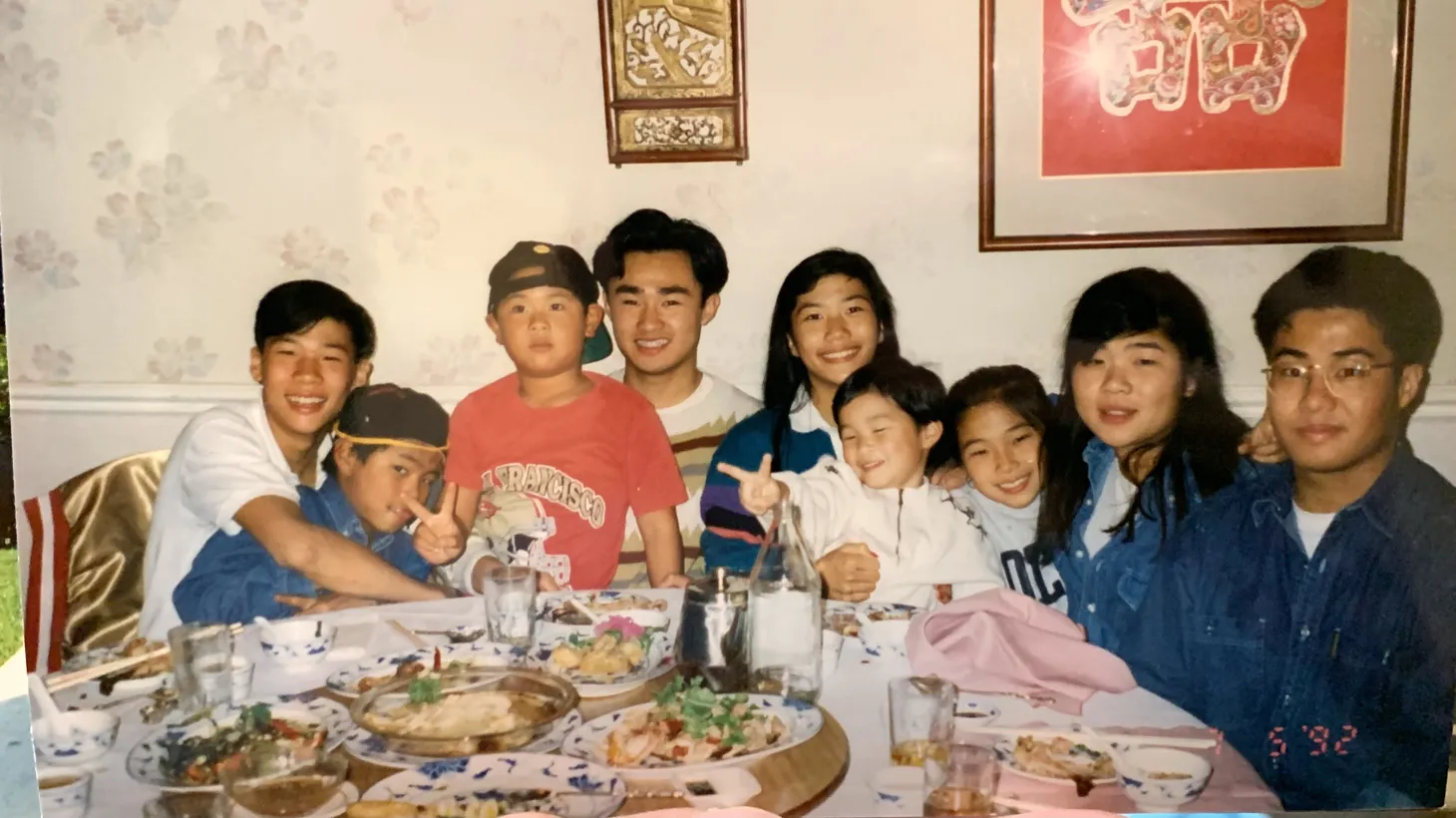 Good Food contributor Kenny Ng (middle, in white) appears with his cousins at Sunday family dinner.