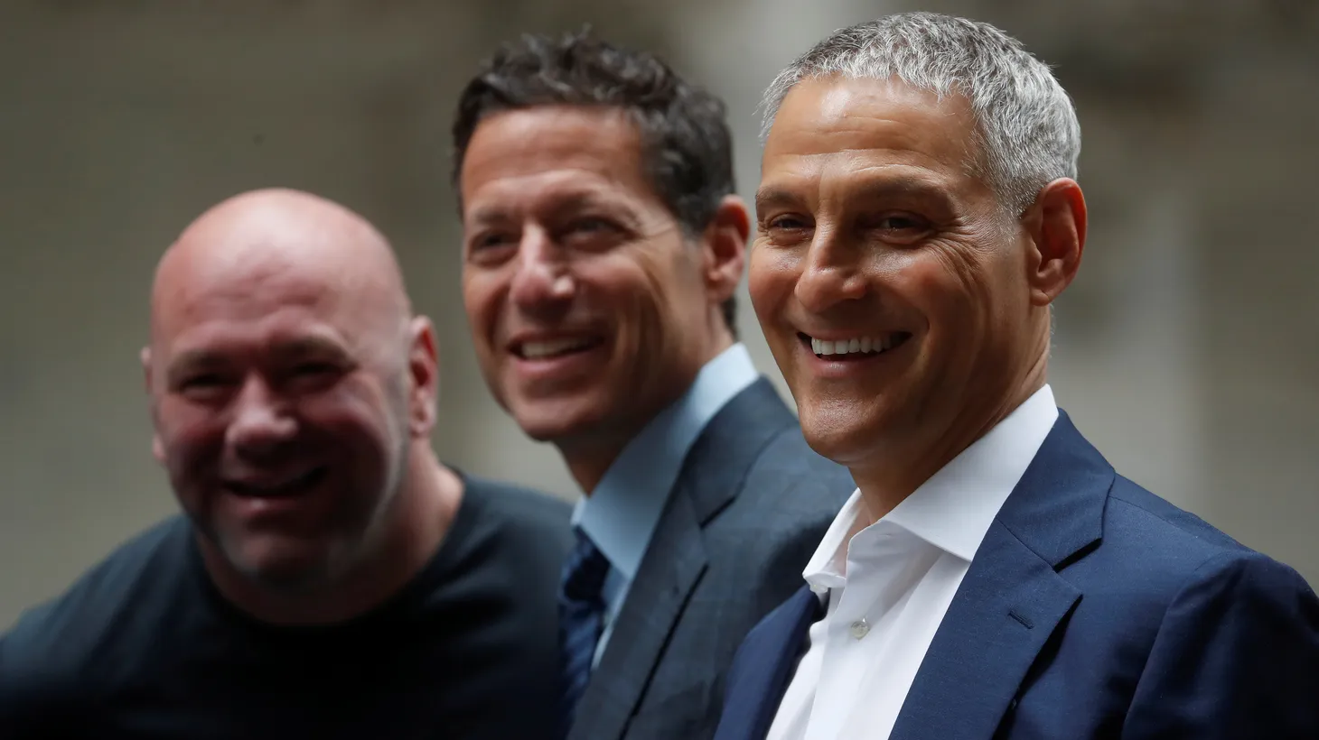 Ari Emanuel, CEO of William Morris Endeavor (right), stands next to Endeavor President Mark Shapiro (center) and UFC President Dana White during the public listing of EDR on the NYSE in New York City on April 29, 2021.