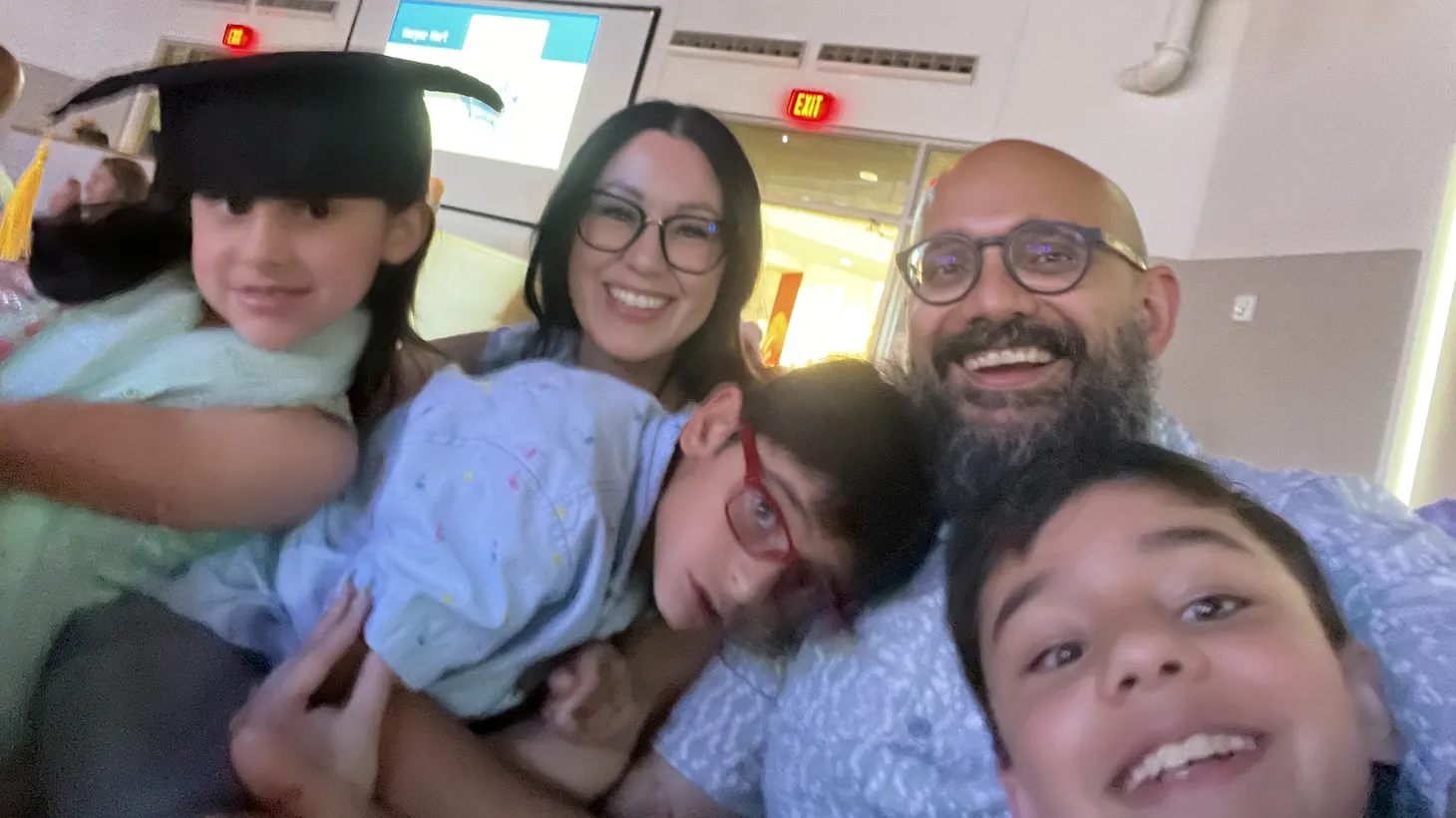 “Being disabled, it's absolutely a defining characteristic of Dominic and certainly a defining characteristic of our family. But I think it's good to know that it's not the only defining characteristic of Dominic, like he's more than that,’ says Professor Shailen M. Singh. Photo of Shailen Singh with his wife and three children.