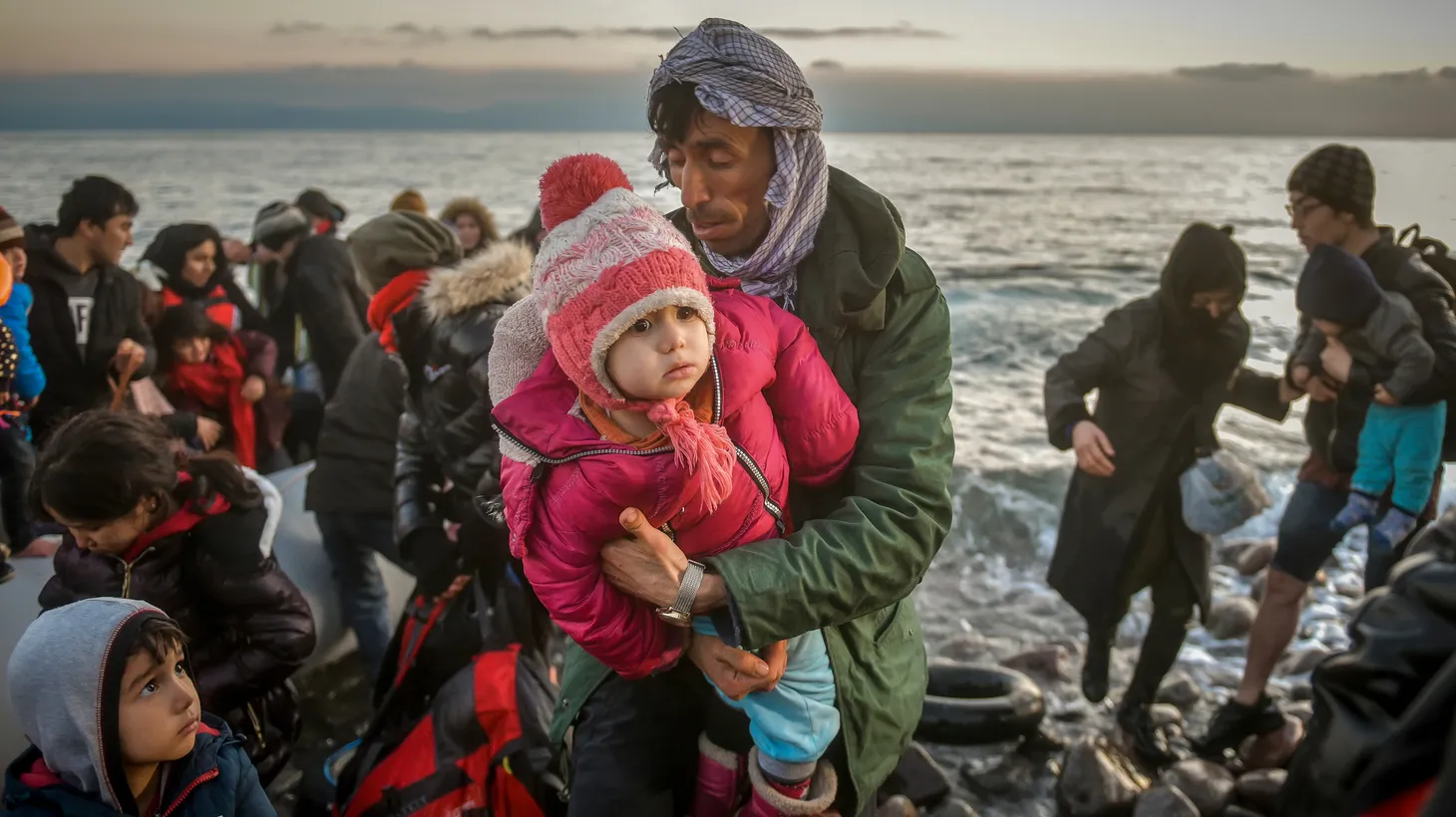 Refugees and Migrants aboard reach the Greek Island of Lesbos after crossing on a dinghy the Aegean sea from Turkey. Lesbos, Greece, March 2, 2020.