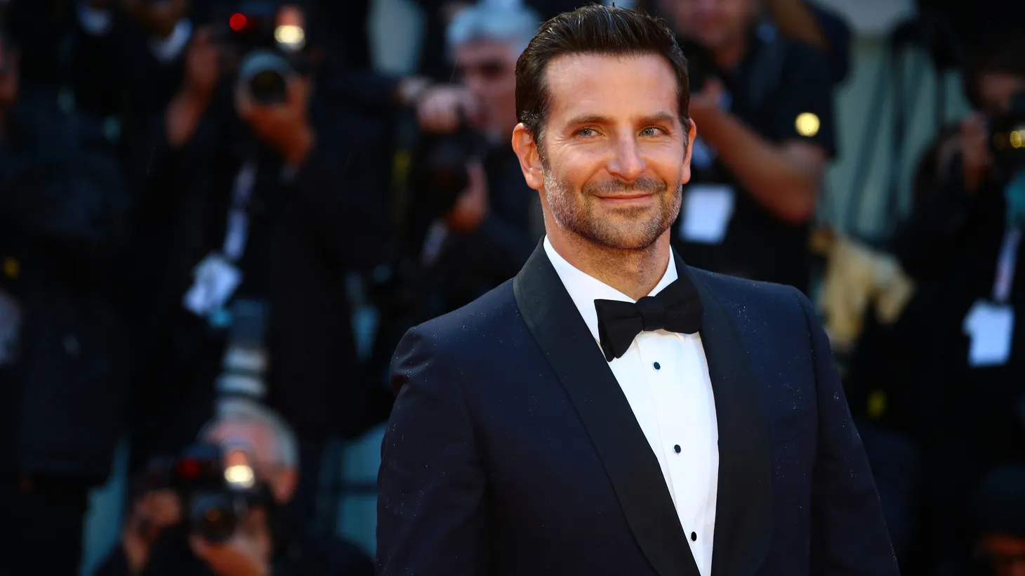 Bradley Cooper walks the red carpet for his movie “A Star Is Born” at the 2018 Venice Film Festival. For that film and others, Cooper passed on an upfront payday and instead took a piece of the profits. Those gambles paid off, but Cooper says “those days are completely gone.”