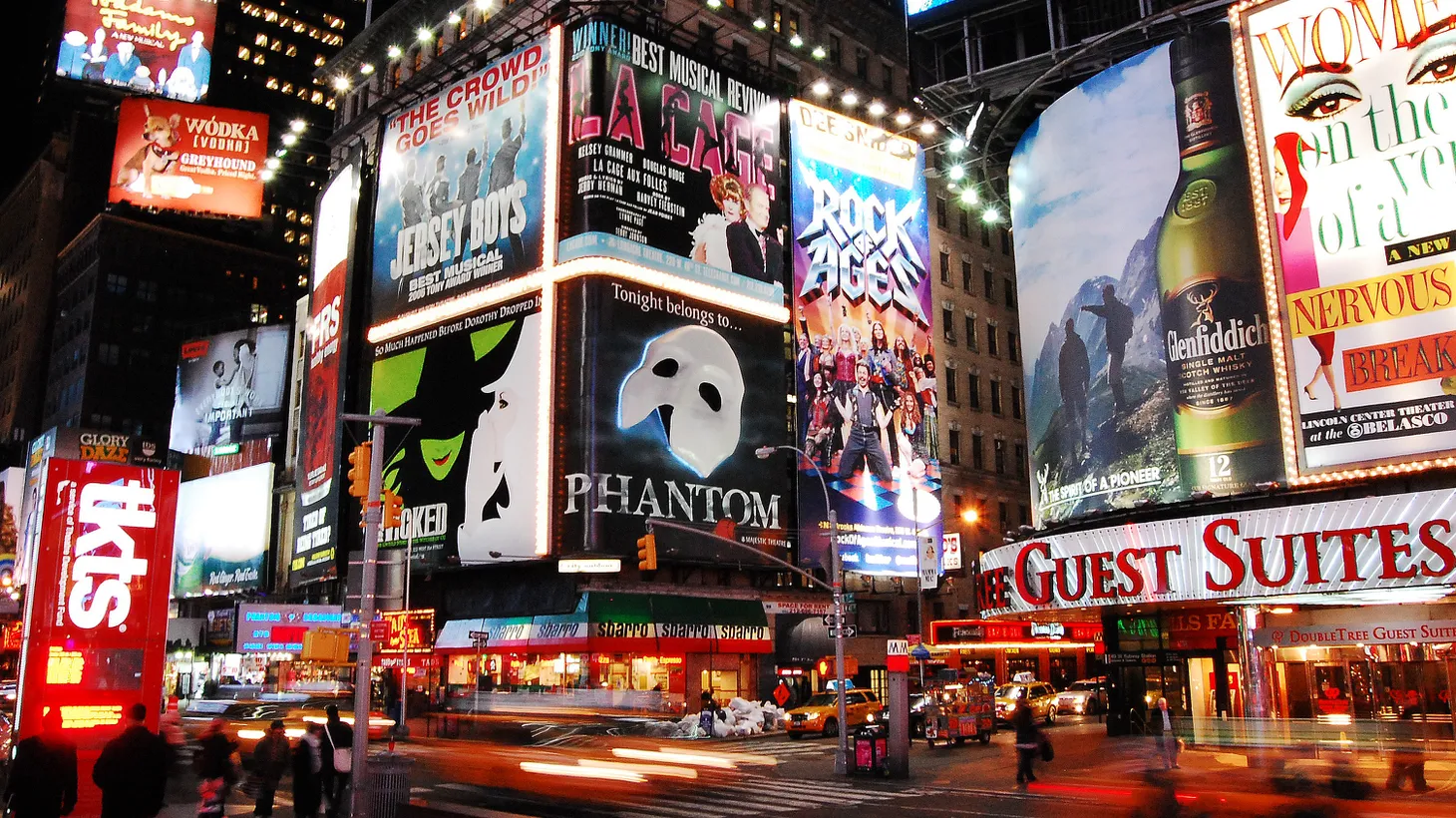 Nighttime in Times Square in New York City featuring billboards of Broadway shows on December 11, 2010.