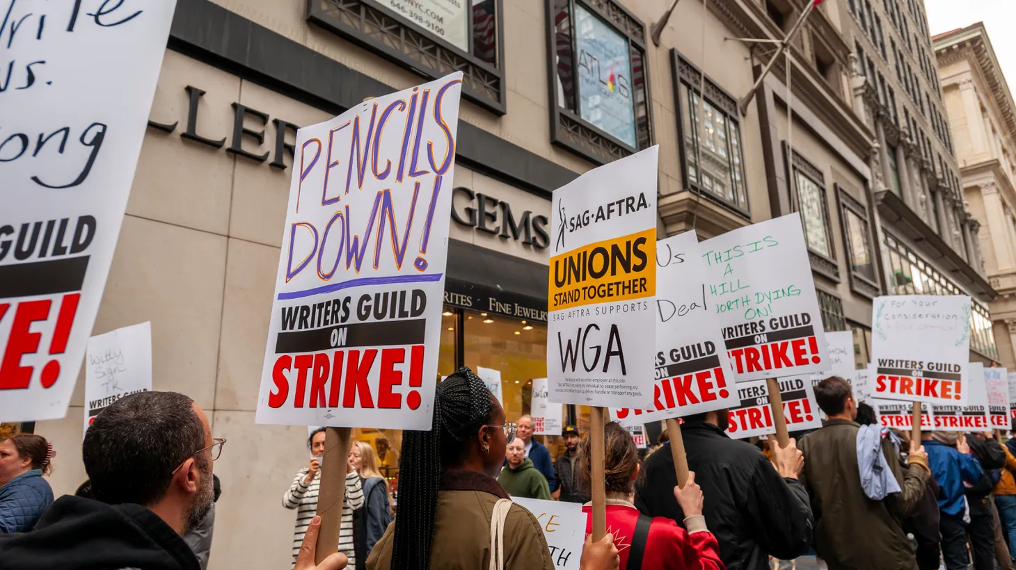 Members of the Writers Guild of America East and their supporters strike outside the Peacock Upfronts on Fifth Avenue on May 2, 2023.
