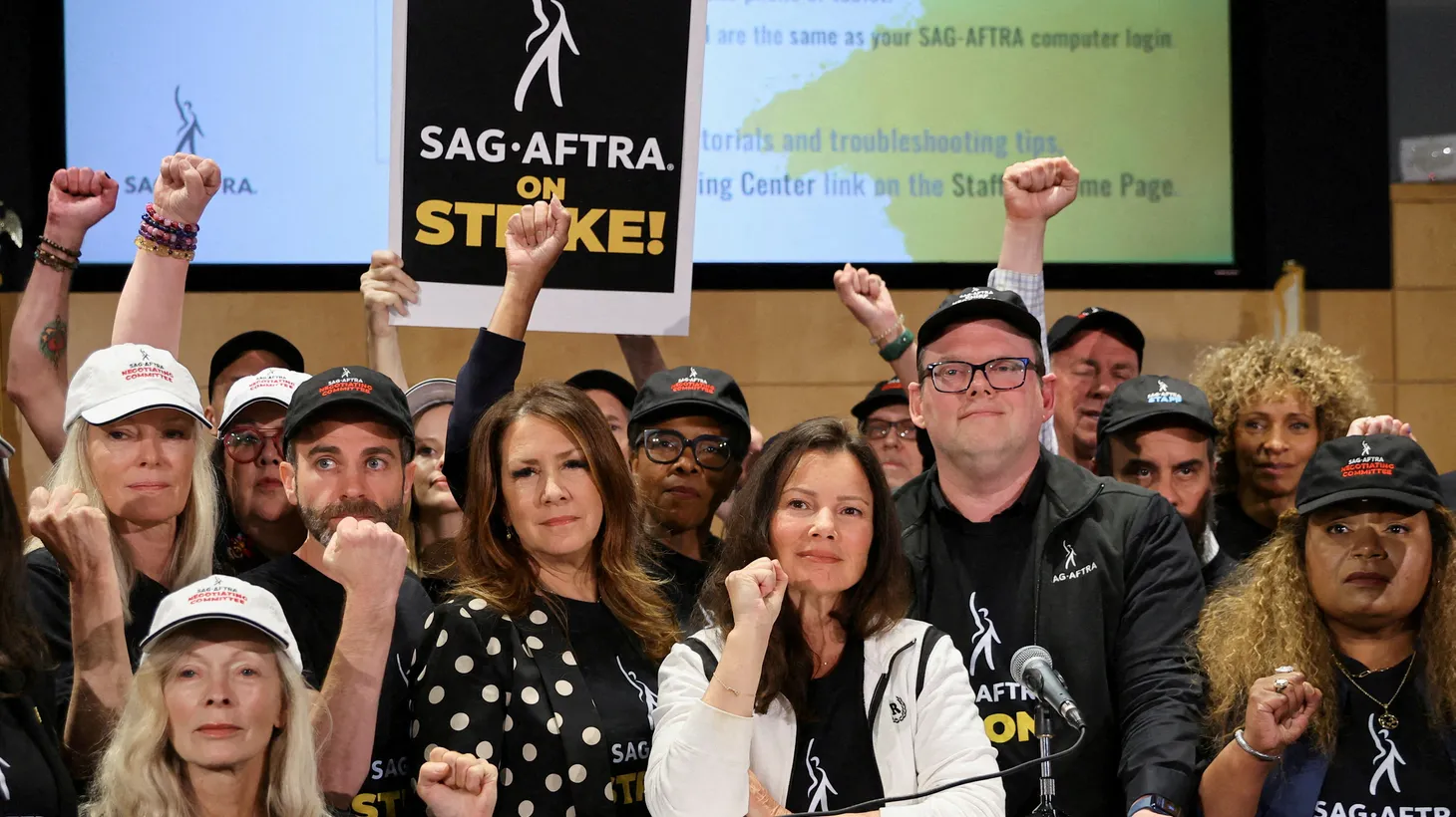 SAG-AFTRA union President Fran Drescher, Duncan Crabtree-Ireland, SAG-AFTRA National Executive Director and Chief Negotiator, and union members gesture at SAG-AFTRA offices after negotiations ended with the Alliance of Motion Picture and Television Producers (AMPTP) in Los Angeles, on July 13, 2023.