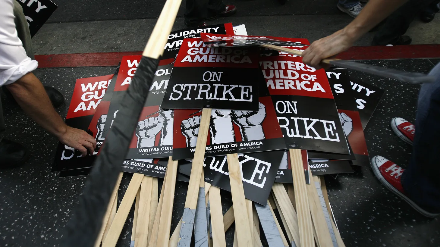 Writers Guild of America striking members pile up their signs at the end of a rally in West in Hollywood on November 20, 2007.