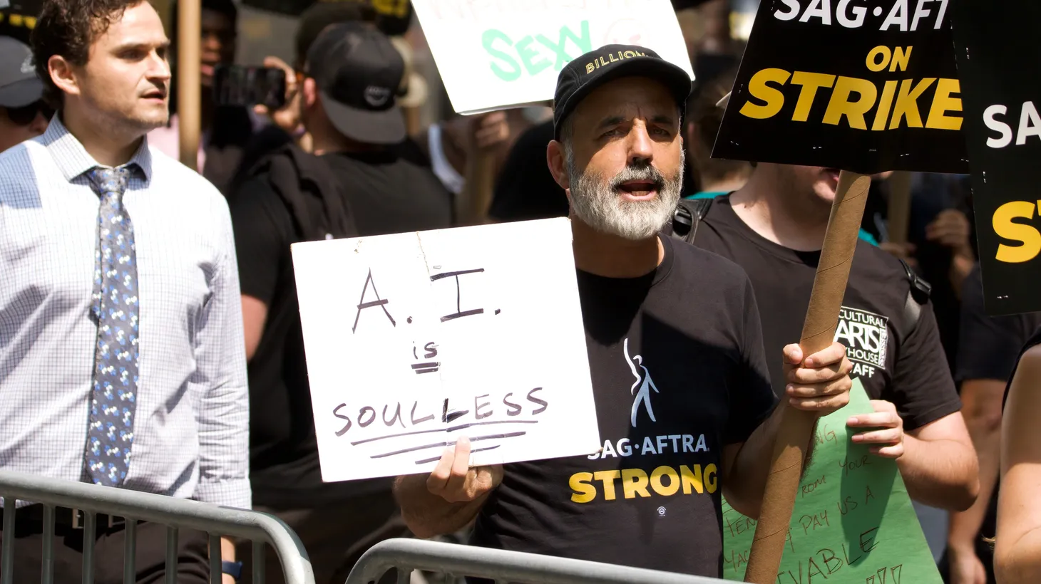 A picketer holds a sign reading “AI is Soulless” at a SAG-AFTRA protest at Rockefeller Center on July 17, 2023.