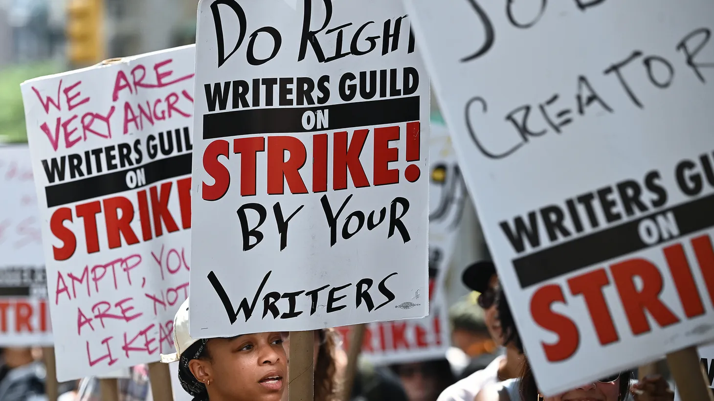 Members of the Writers Guild of America East picket outside the Warner Bros. Discovery offices in New York on July 13, 2023.