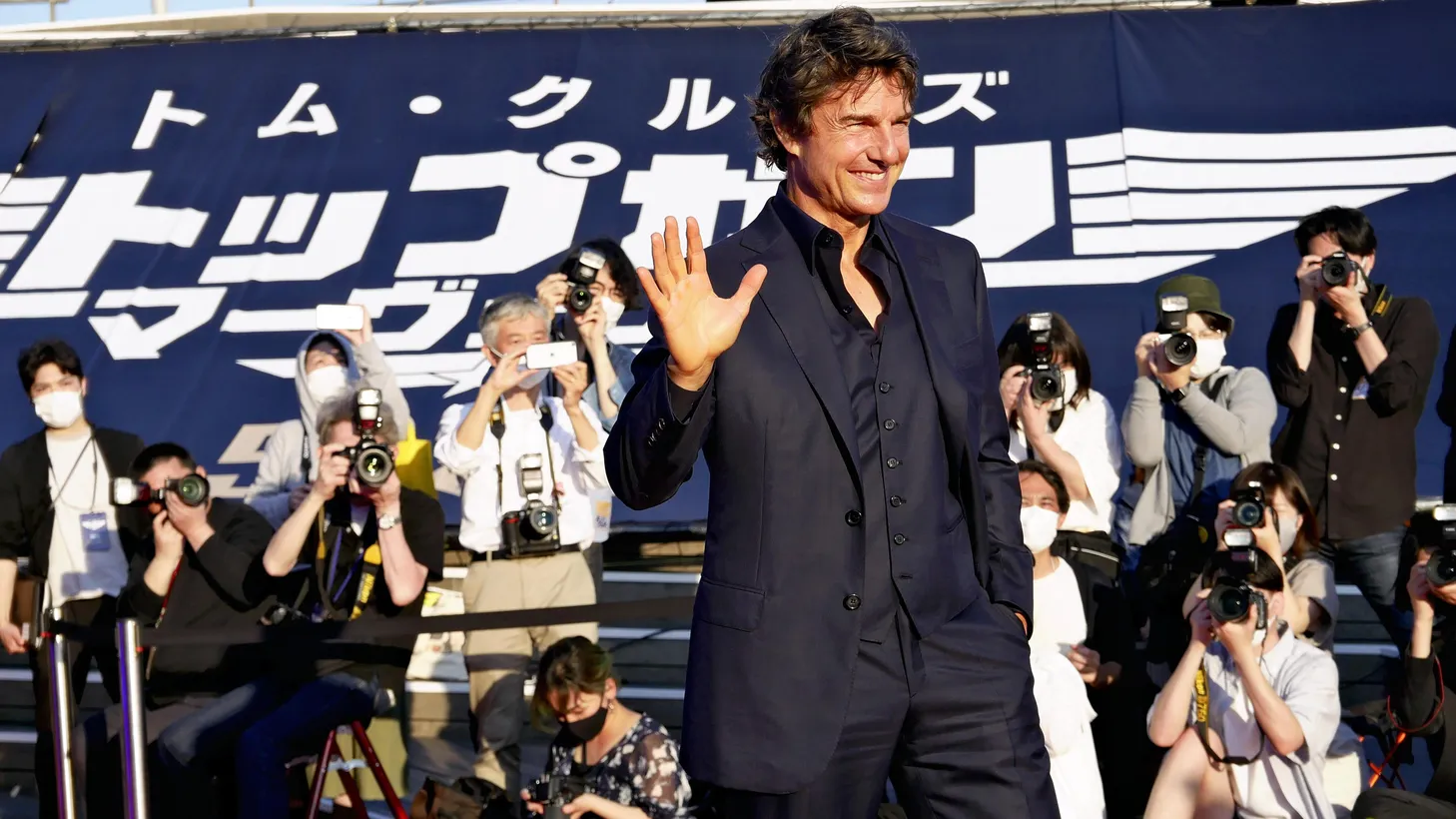 Actor Tom Cruise waves to fans at the Japan premiere of “Top Gun: Maverick” at Osanbashi Yokohama International Passenger Terminal in Kanagawa Prefecture on May 24, 2022.