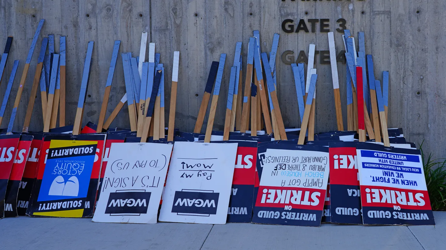 Writers Guild of America signs sit near the Culver Studios in Culver City, Calif. on August 30, 2023 waiting for picketers who had been on strike since May 2 over an ongoing labor dispute with Hollywood studios.