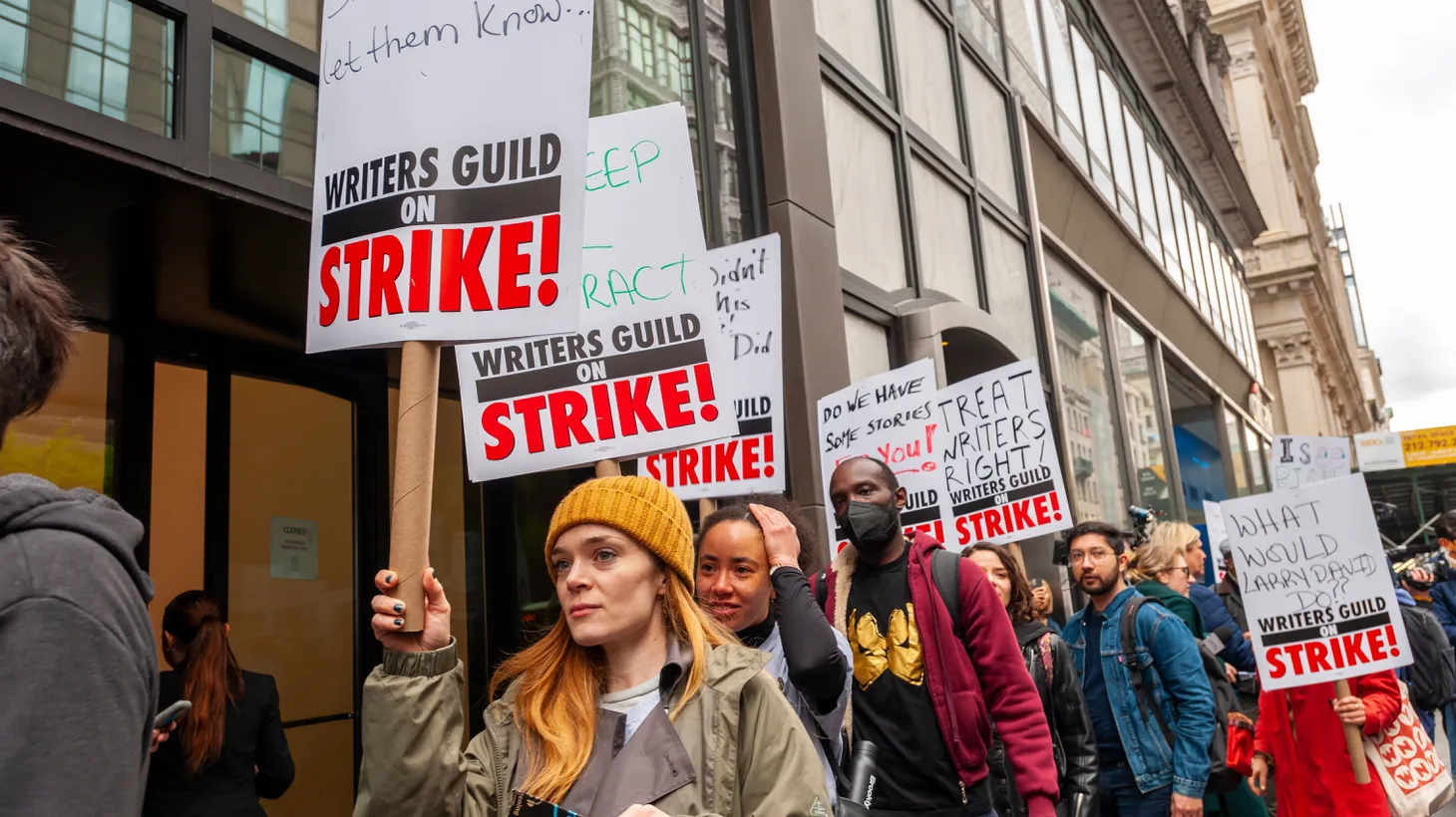Members of the Writers Guild of America East and their supporters strike outside the Peacock Upfronts on Fifth Avenue in New York on May 2, 2023.