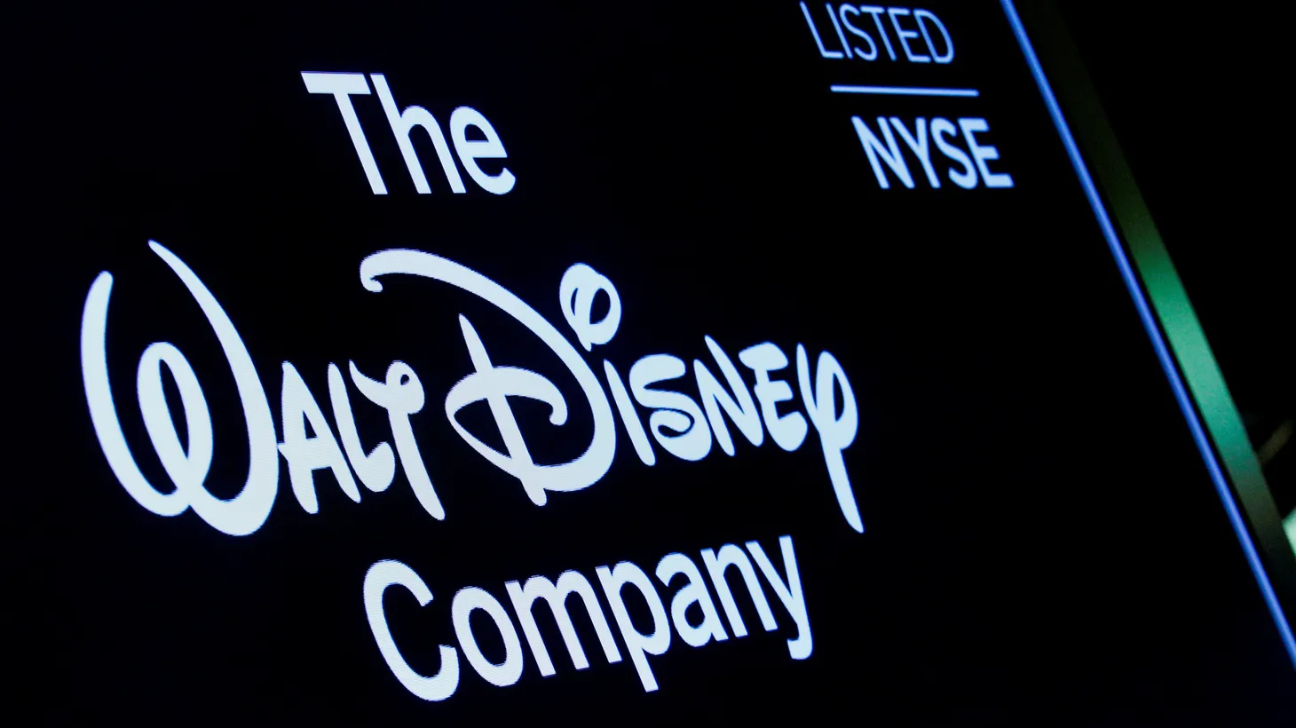A screen shows the logo and a ticker symbol for The Walt Disney Company on the floor of the New York Stock Exchange (NYSE) in New York, on December 14, 2017.