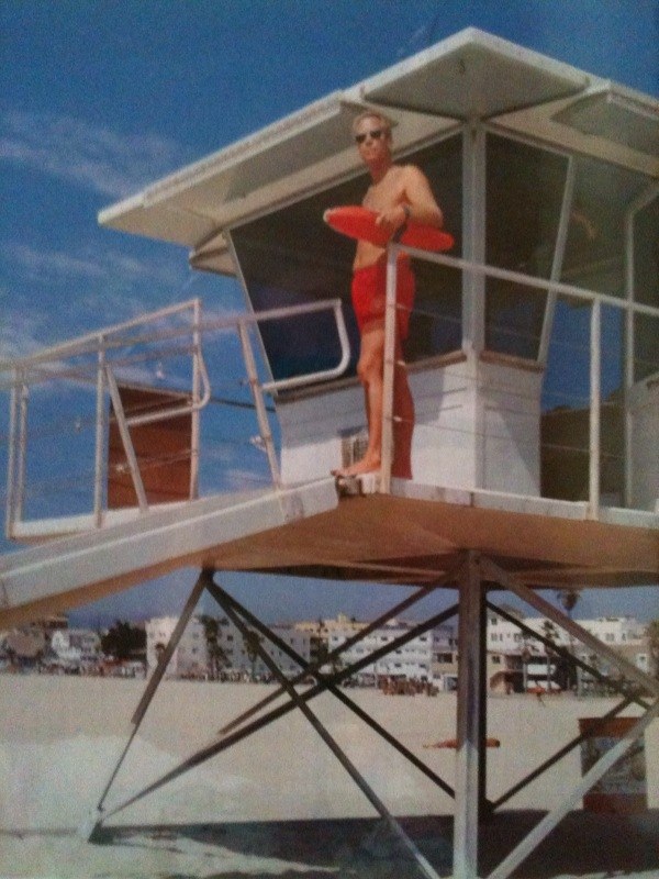 Tom Schnabel on a lifeguard tower 
