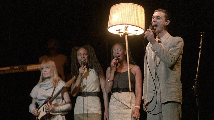 The late Jonathan Demme stops by KCRW in 1984 to discuss making the now-iconic Talking Heads concert doc "Stop Making Sense." The A24 restoration of the film is in theaters now.