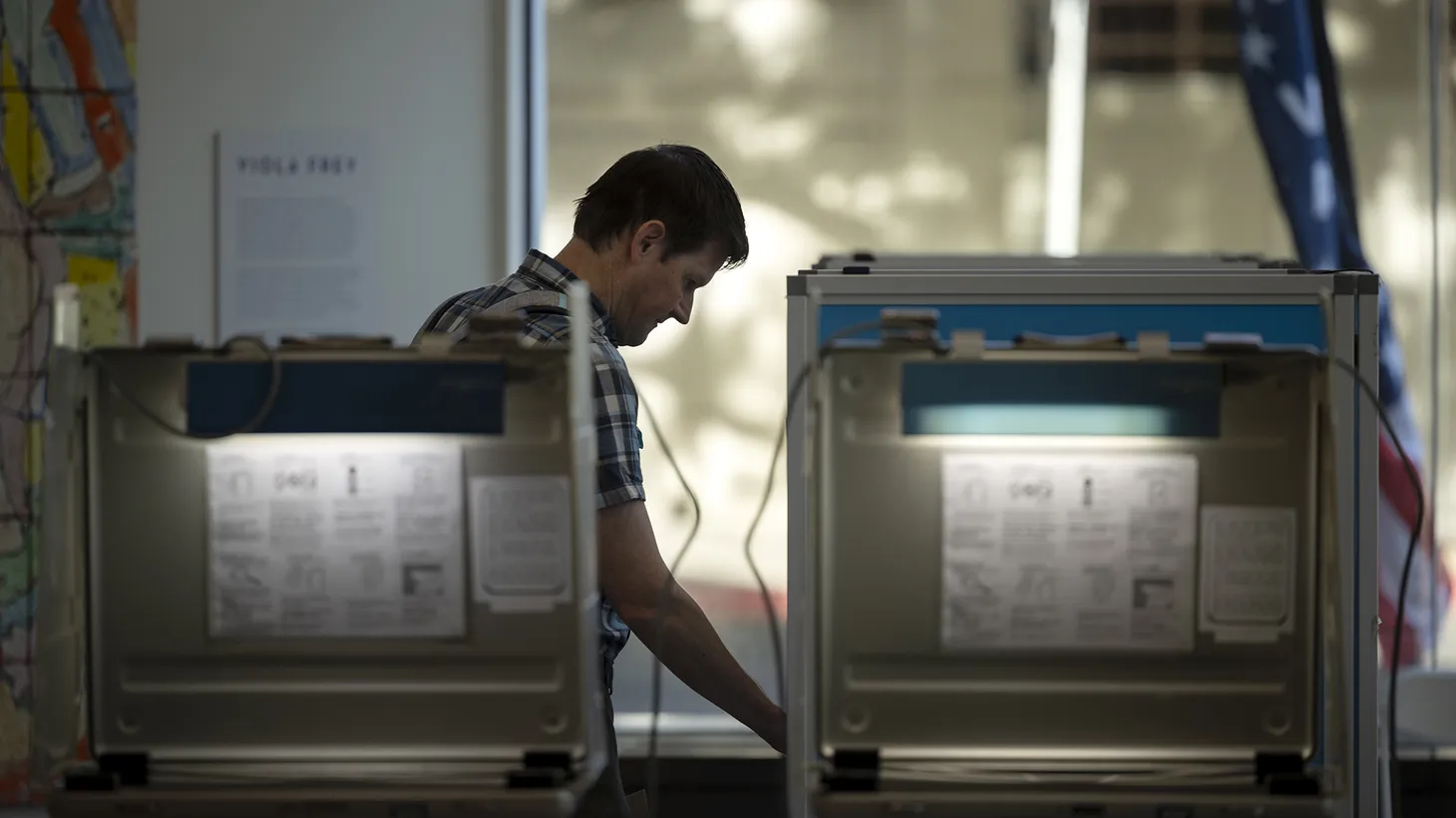A voter casts their ballot at a voting site at the California Museum in downtown Sacramento on June 7, 2022.