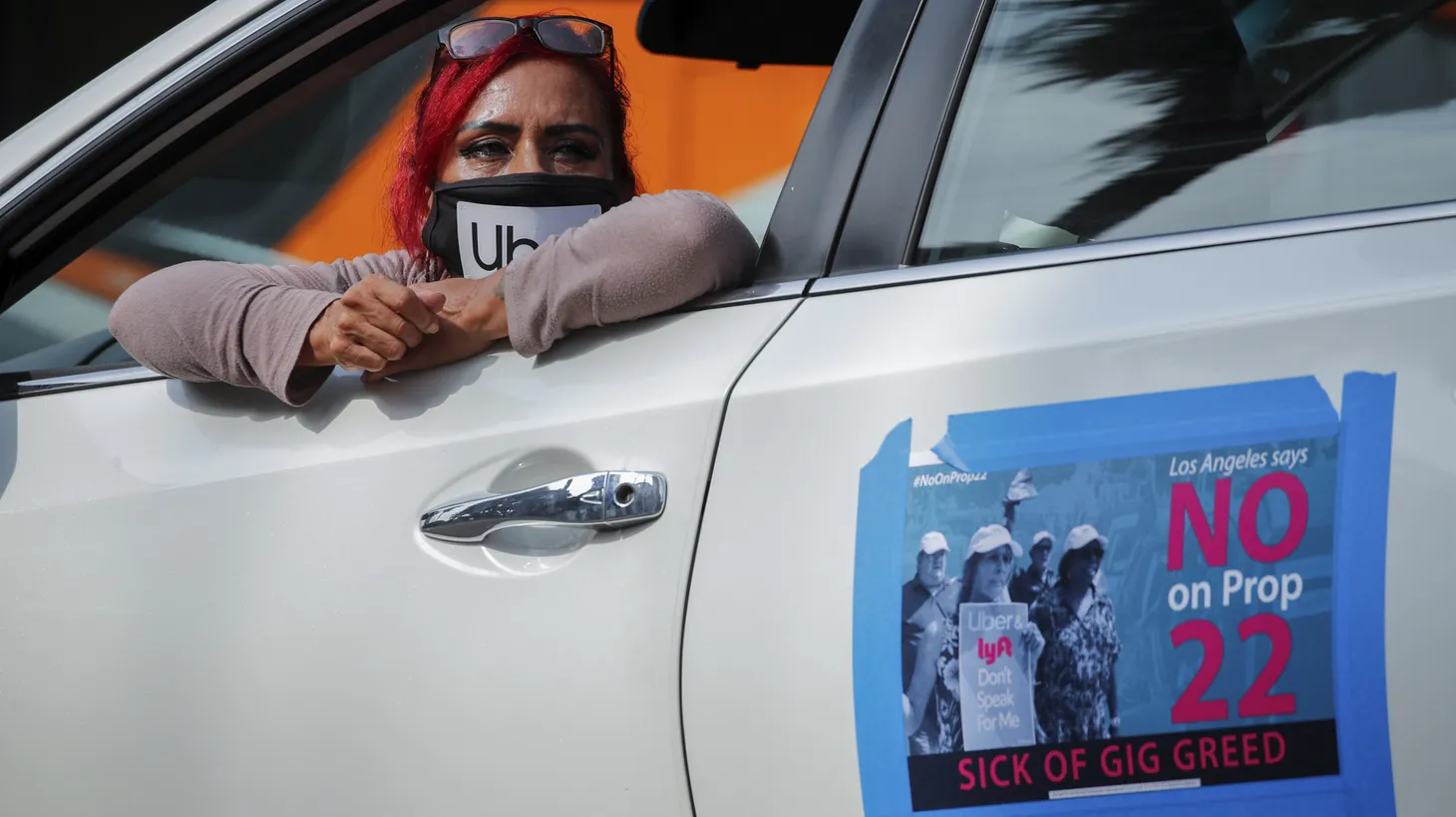 App-based gig worker Terresa Mercado participates in a demonstration outside Los Angeles City Hall to urge voters to vote no on Proposition 22, a November ballot measure that would classify app-based drivers as independent contractors and not employees or agents, in Los Angeles, California, U.S., October 8, 2020.