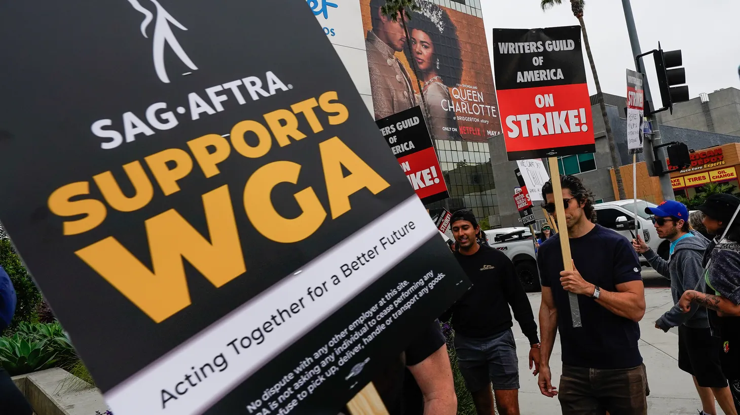 Members of the Writers Guild of America picket at Sunset Bronson Studios, where Netflix Studio is located. One sign says, “SAG-AFTRA supports WGA.” The writers are seeking a new contract with the Alliance of Motion Picture and Television Producers. May 23, 2023. Los Angeles, California, USA.