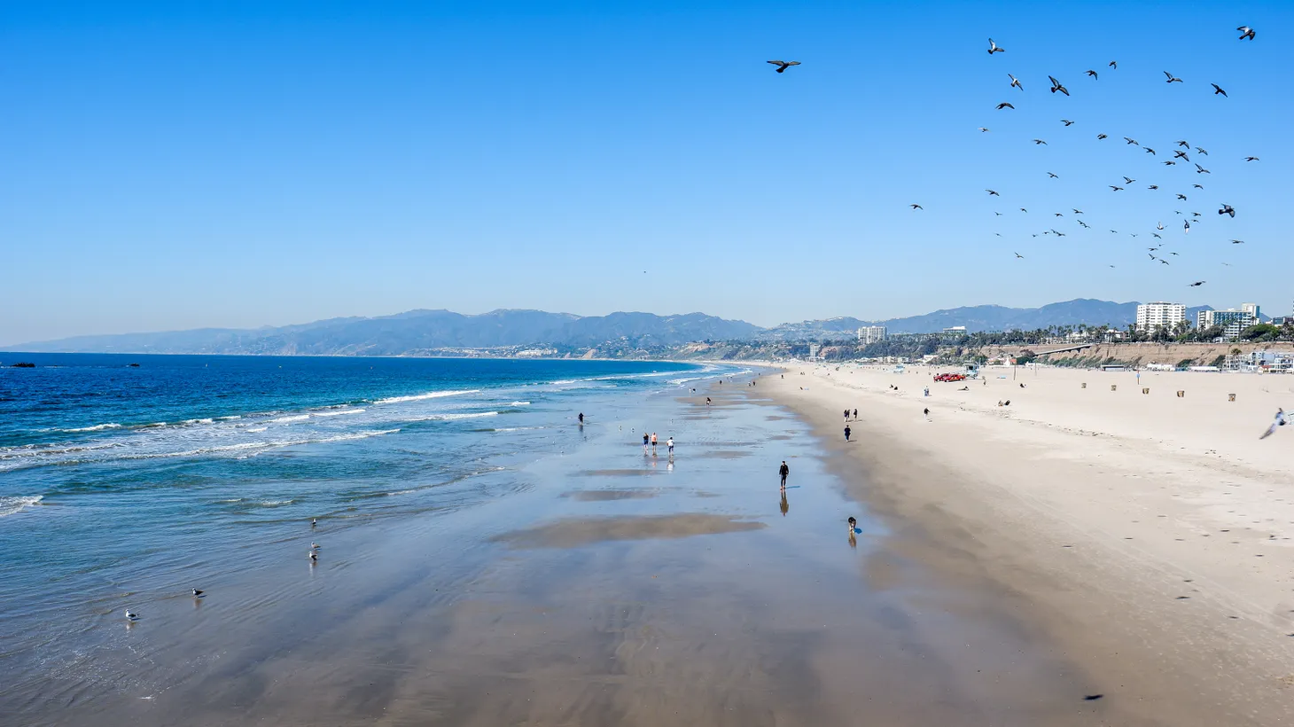 Santa Monica beach is seen on a clear day, February 25, 2022. The air is cleaner than in the past — South Coast Air Quality Management District says ozone levels are at less than half of what they were in the 1950s.