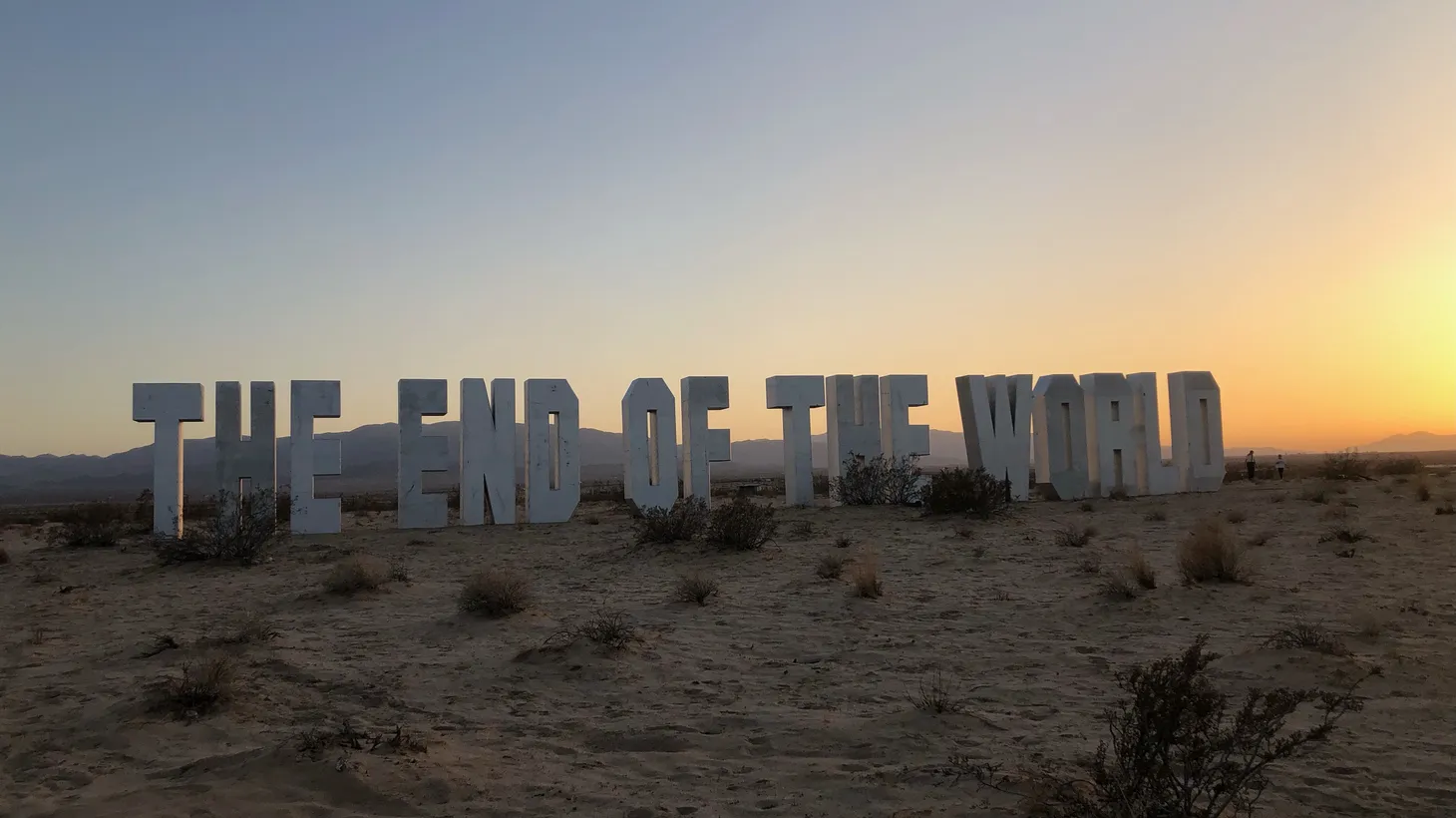 Jack Pierson’s wooden words “The End of the World” is now displayed in the Mojave Desert, along with work by eight other artists as part of “The Searchers” exhibit.