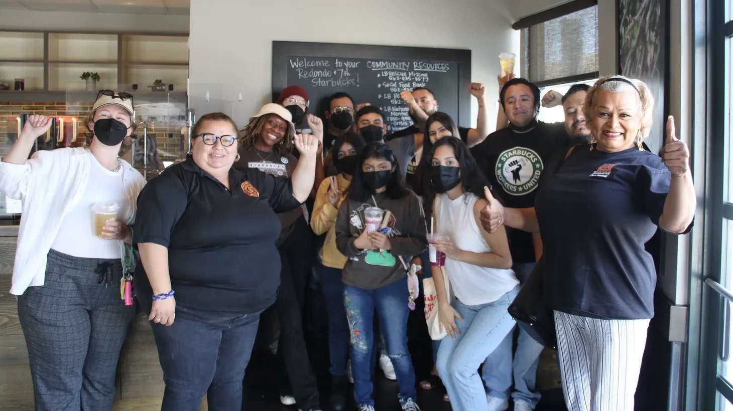Baristas at a Starbucks in Lakewood pose with customers who support their union campaign. Employees at the store have until May 13 to cast their ballots.