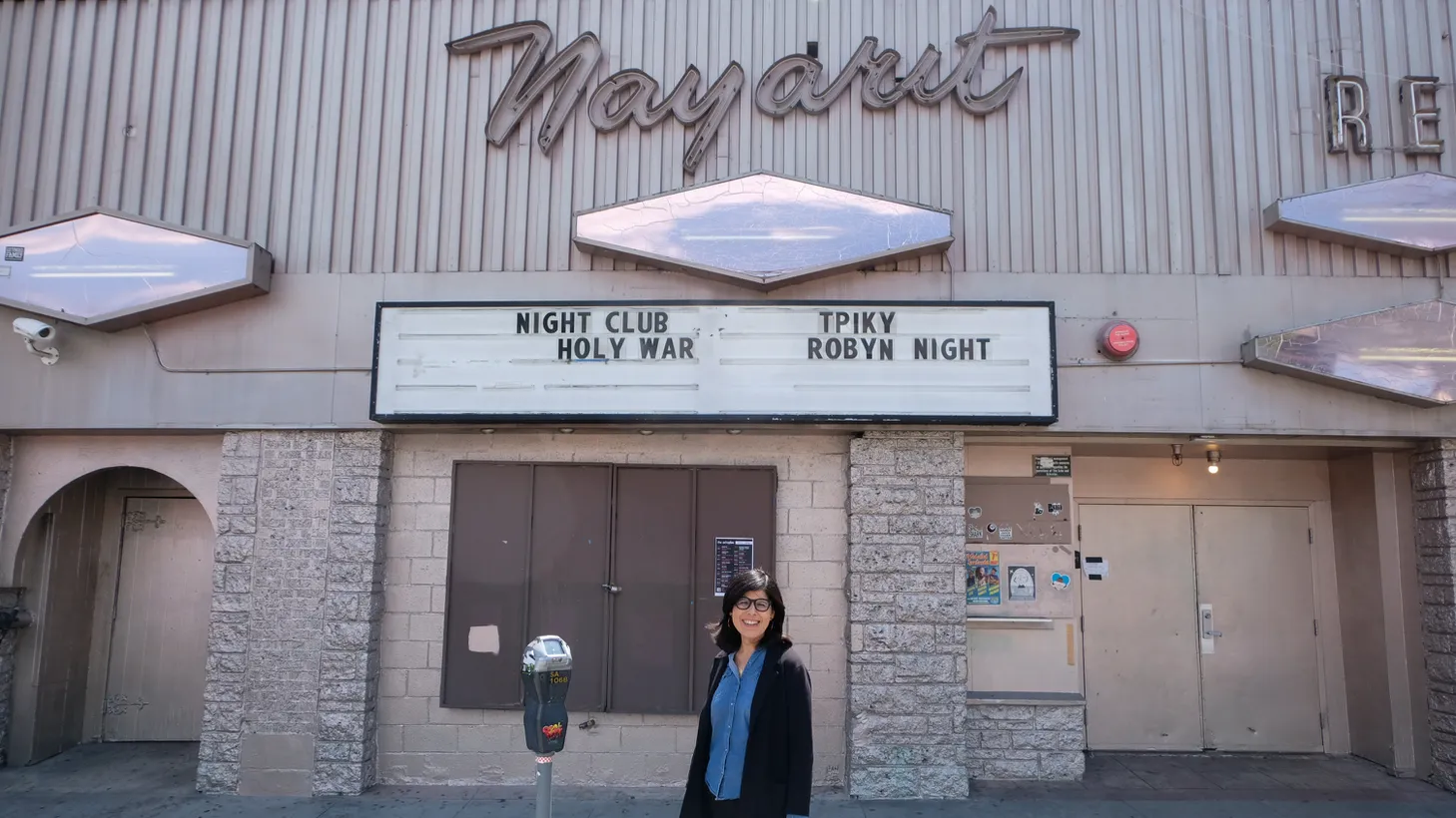 Natalia Molina stands in front of the Nayarit, which is now the Echo nightclub. Her family owned the Mexican restaurant, which welcomed neighborhood newcomers and immigrants for decades.