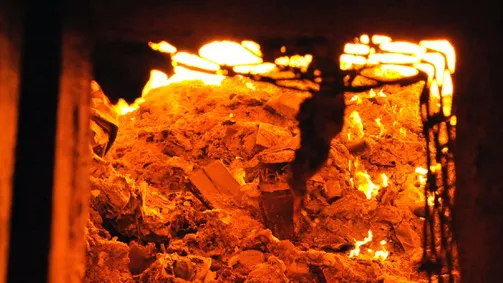 Waste gets incinerated in a furnace in Long Beach before it’s shipped to a landfill.