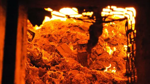 Waste gets incinerated in a furnace in Long Beach before it’s shipped to a landfill.